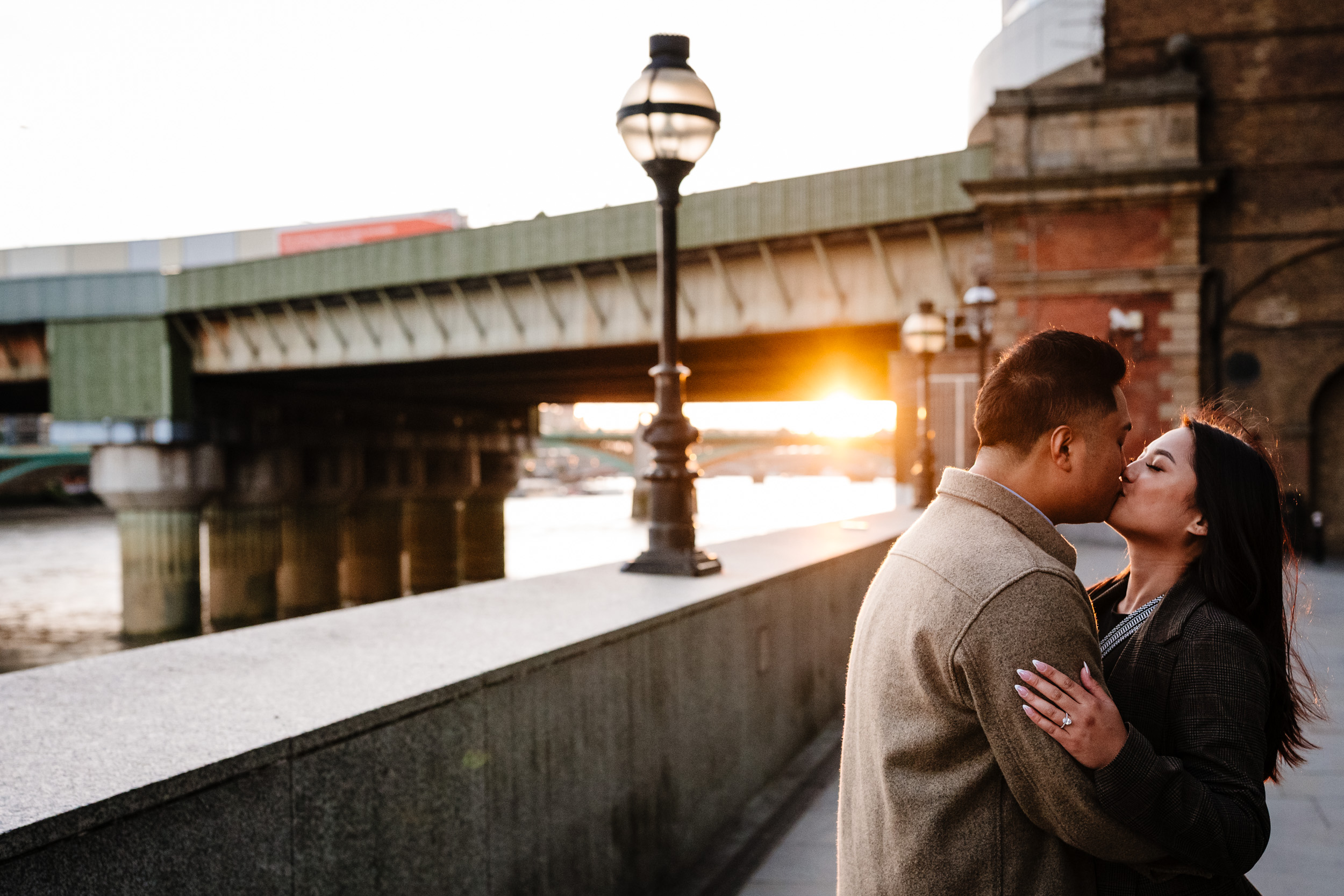 couple kissing during sunset