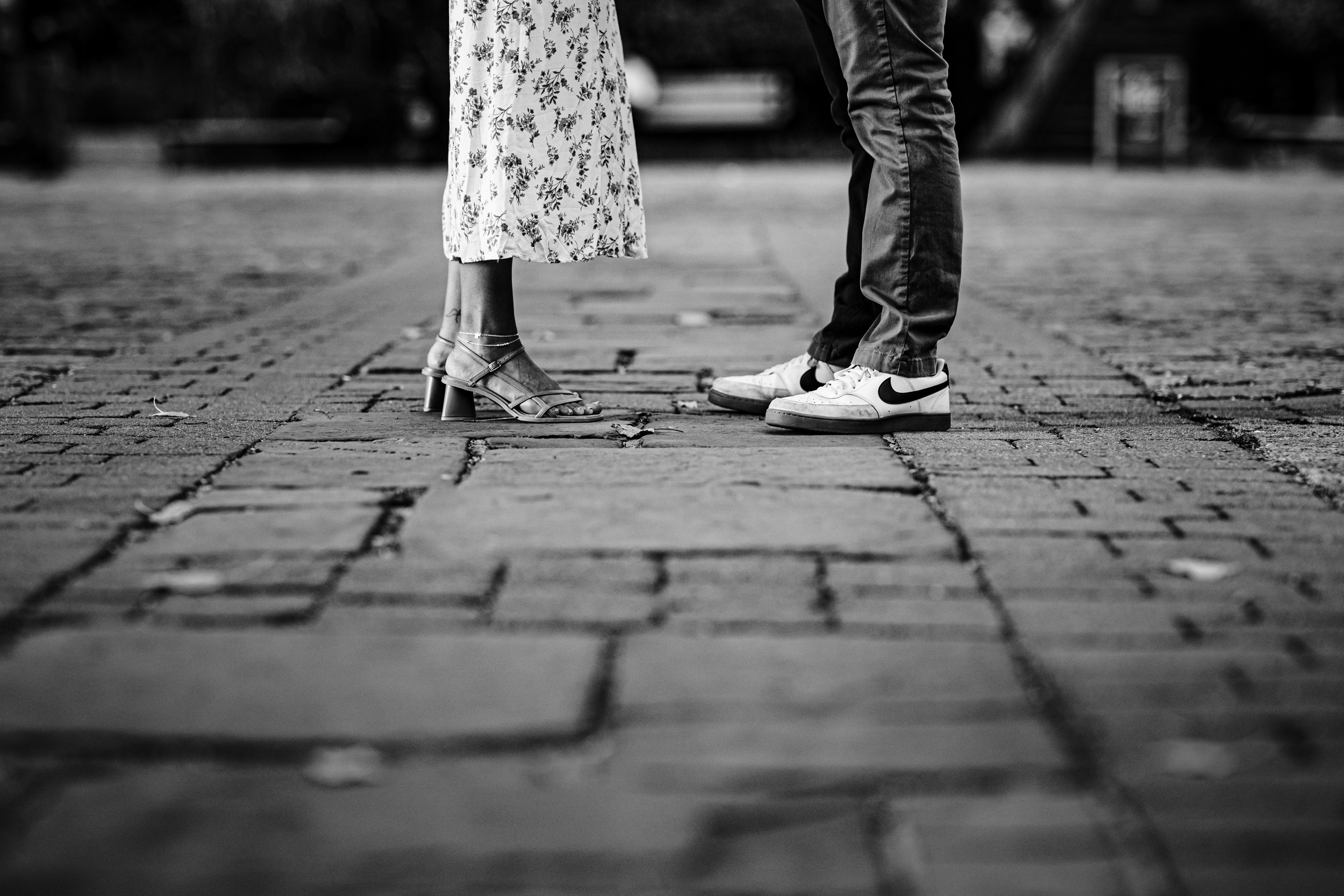 legs and feet of couple looking at each other