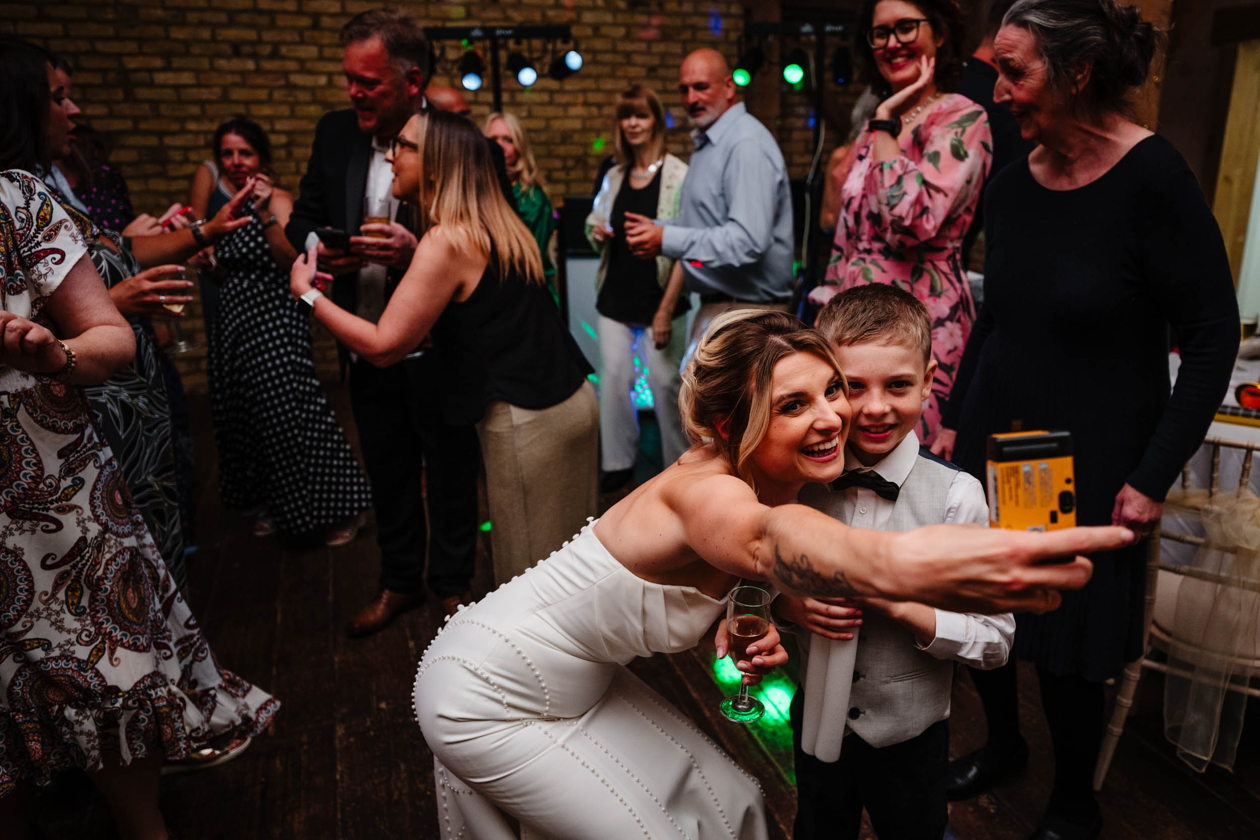 bride takes a selfie with son