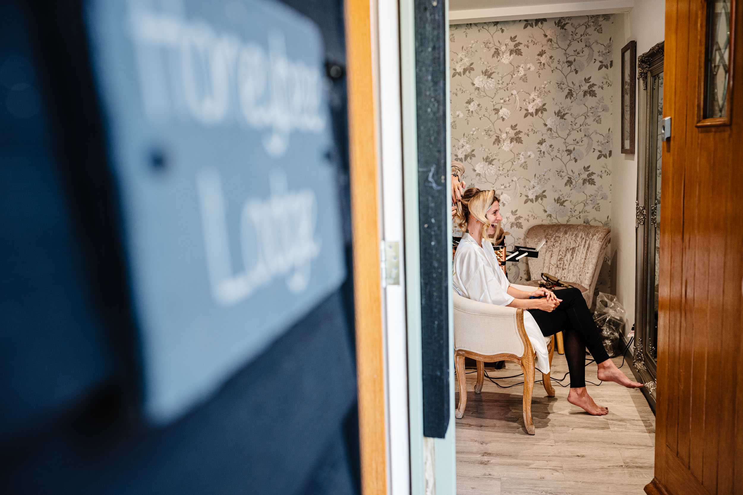 bride laughing inside getting ready space