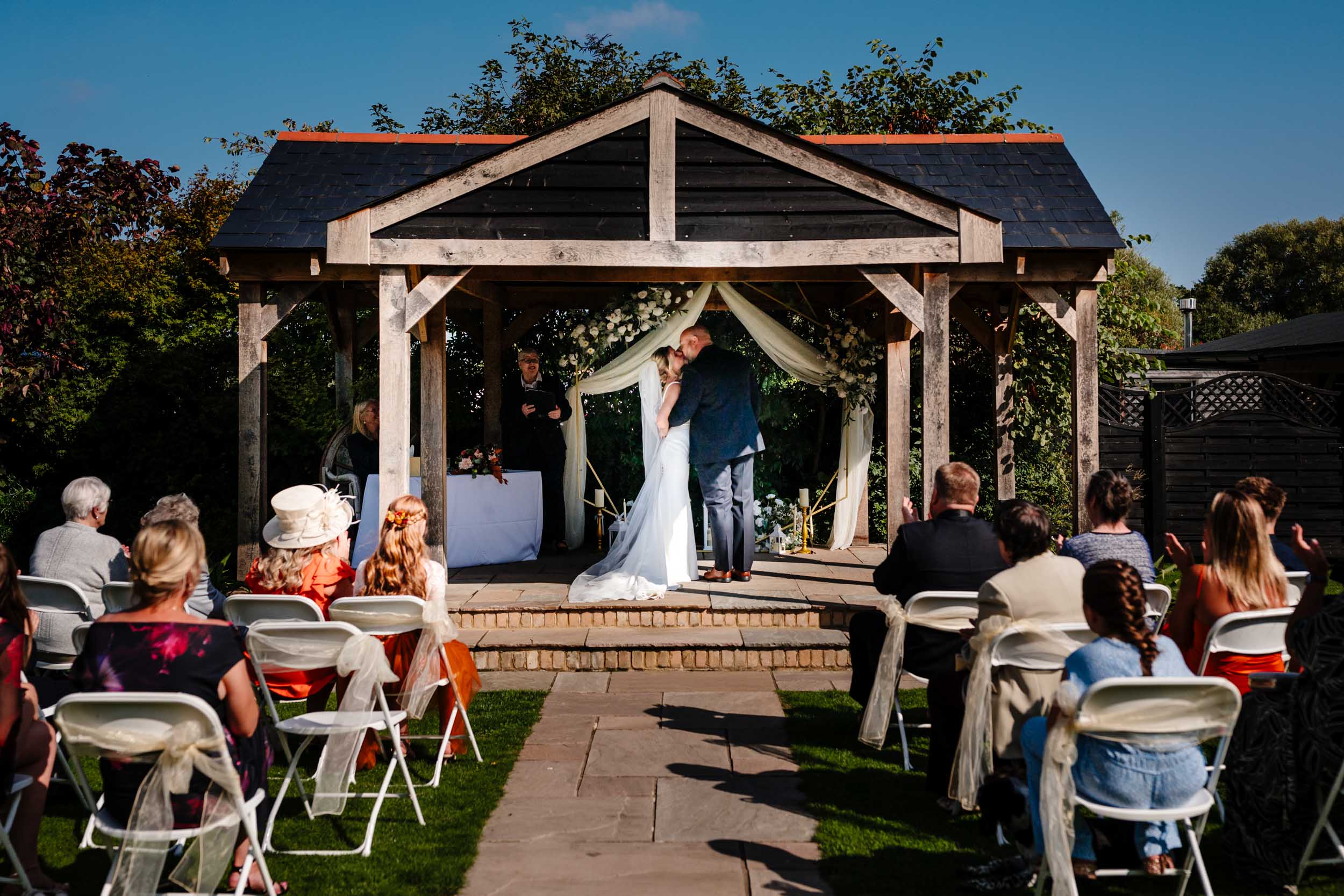 bride and groom first kiss