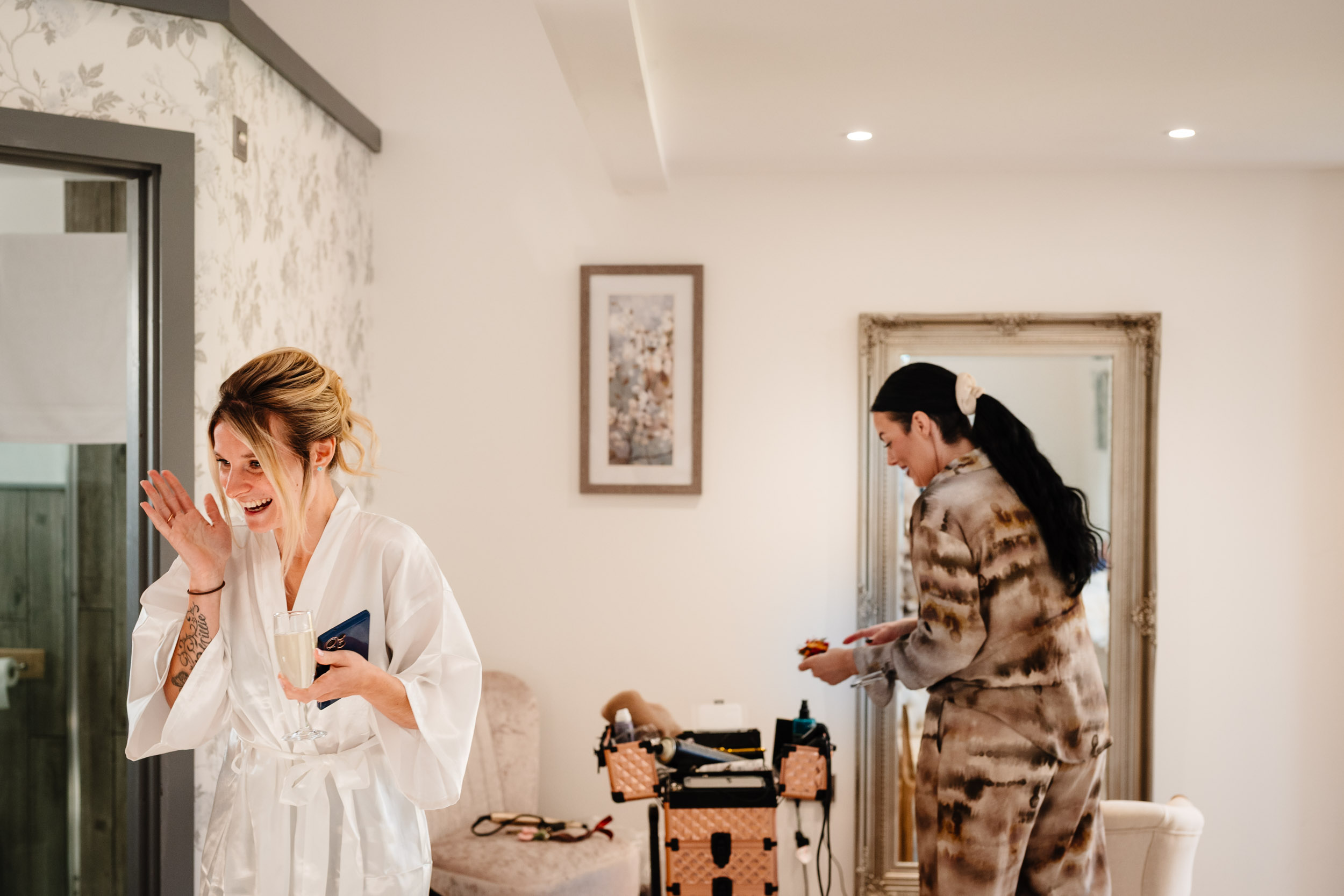 bride having good time during prep
