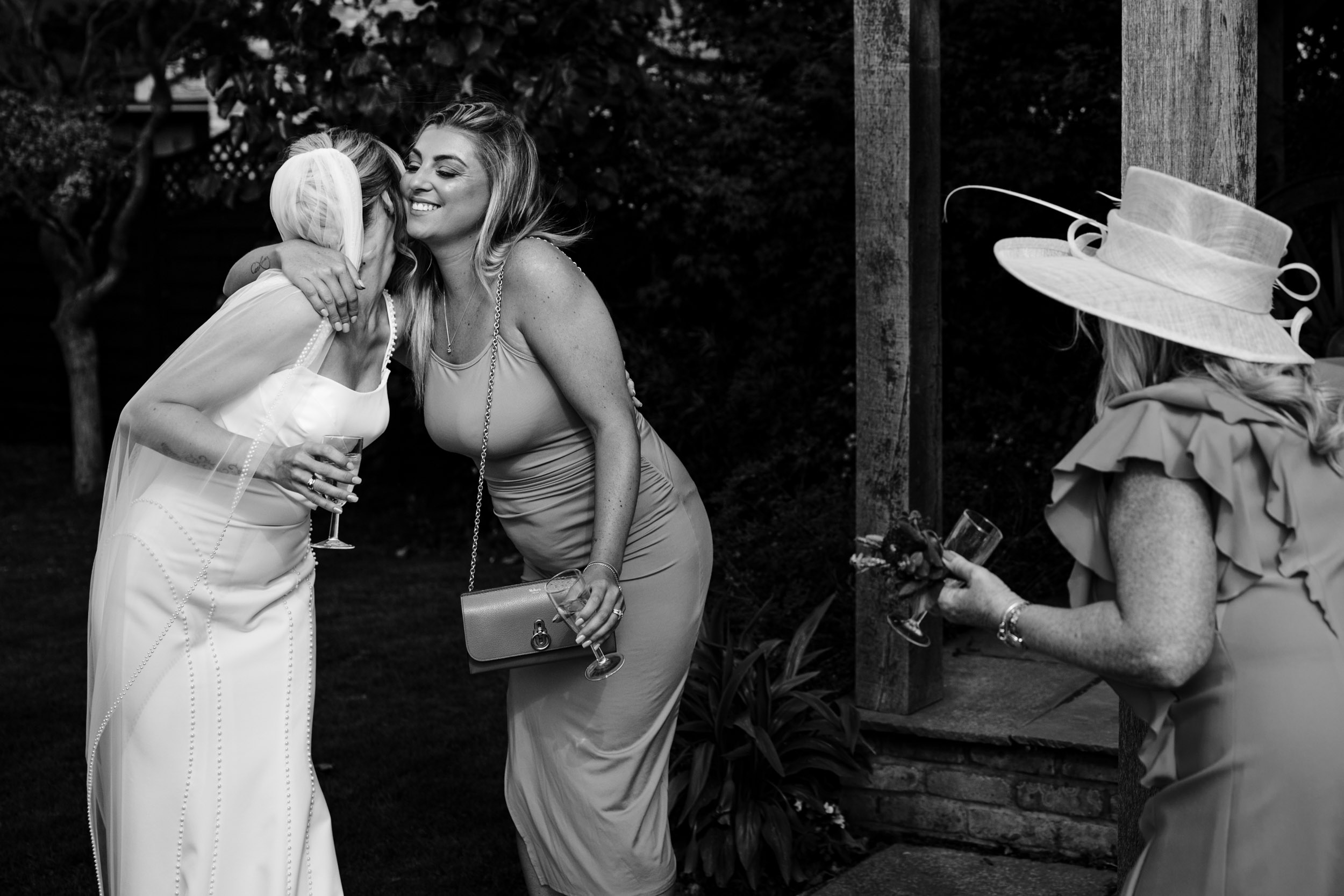 bride kissing friend