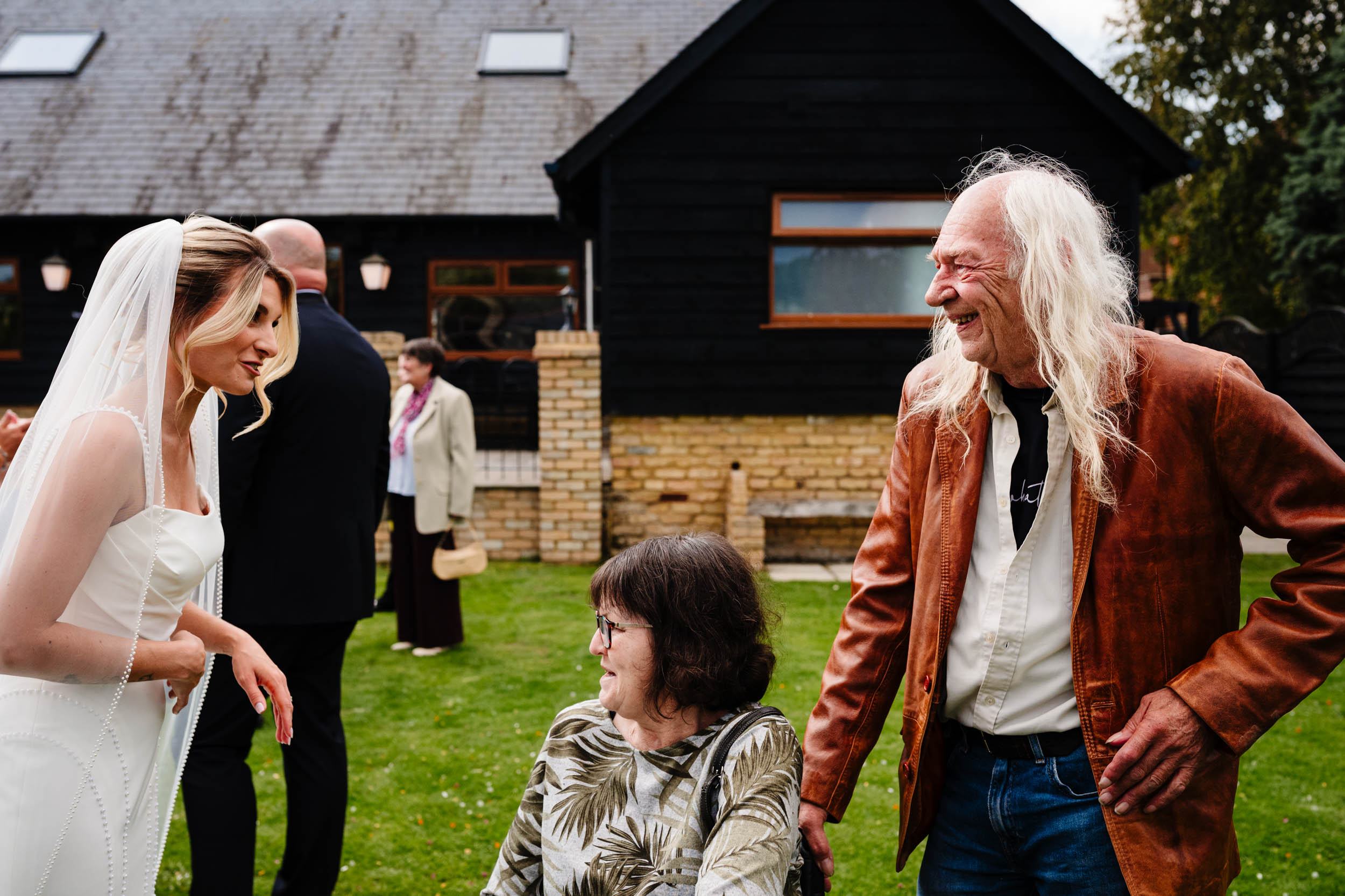 bride and guests laughing