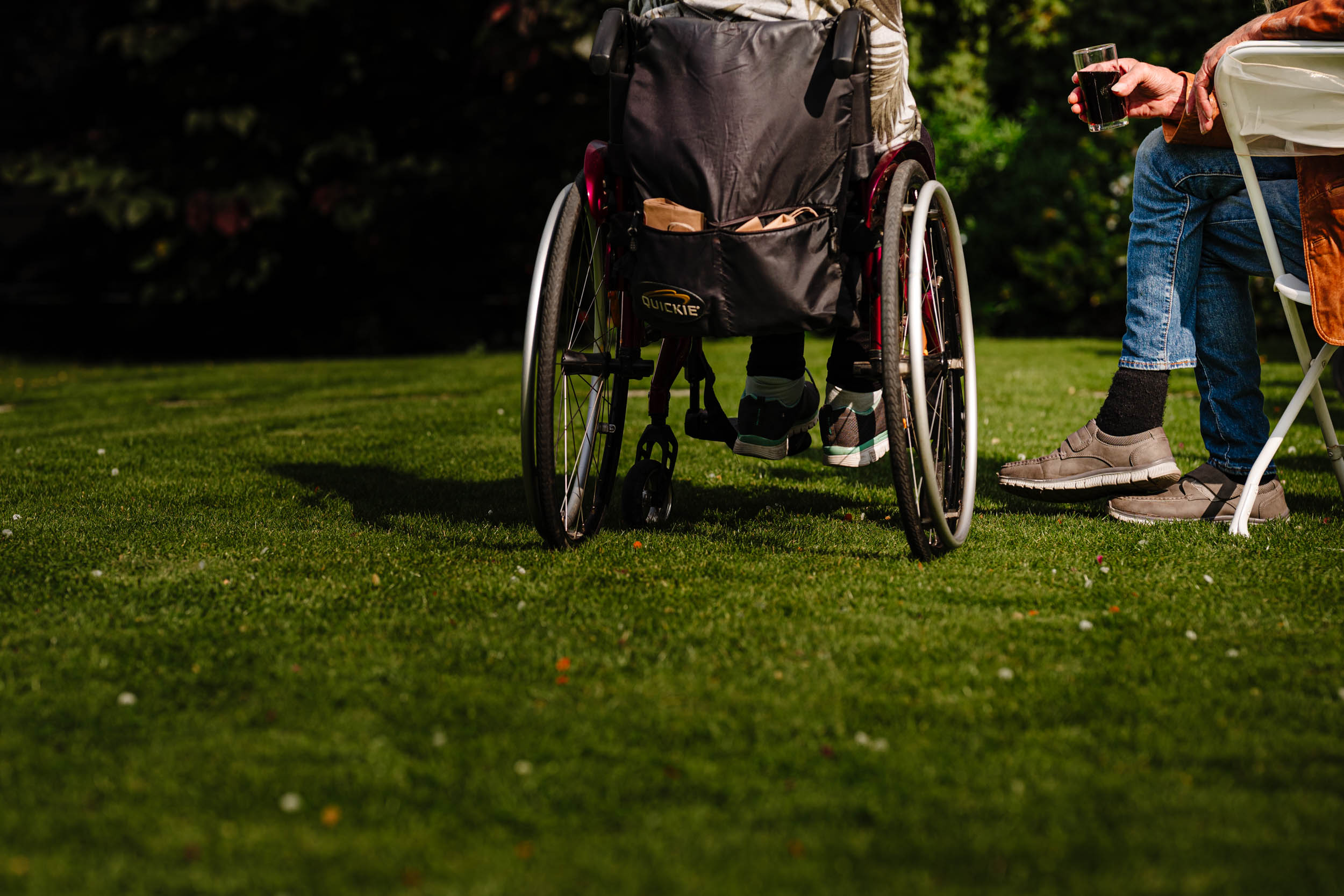 guy sat next to his partner in wheelchair