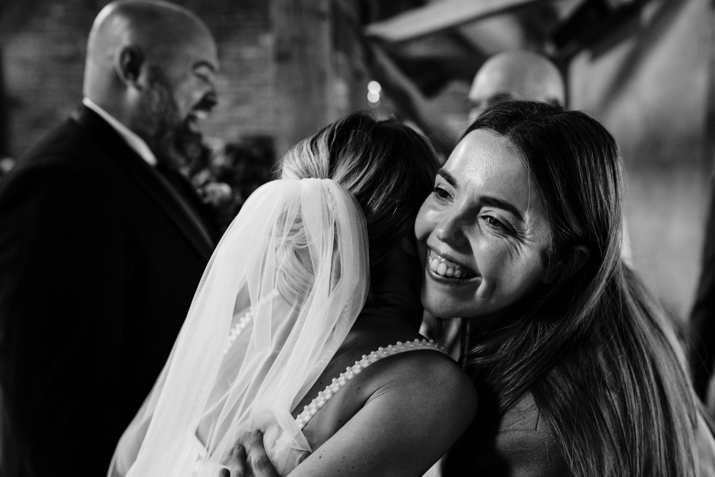bride and groom hugging