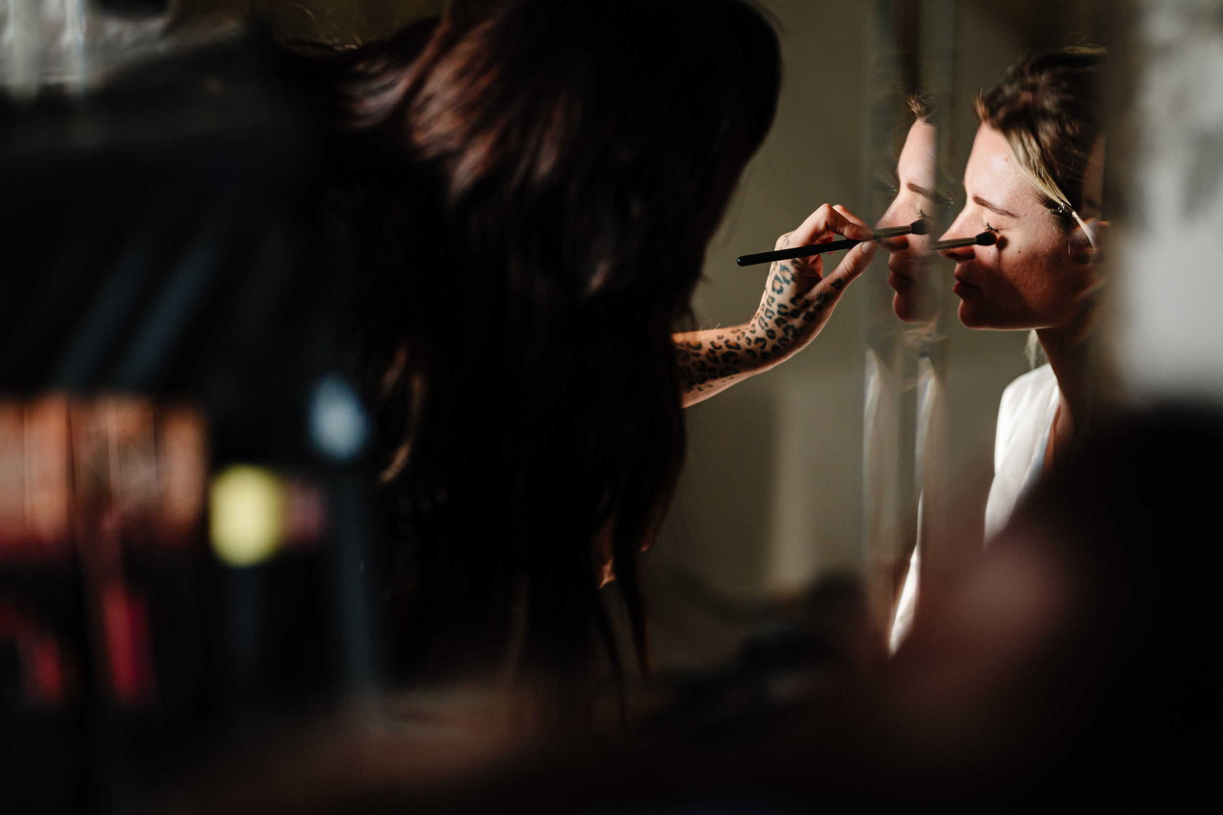 mirror reflection of the bridewhile having make up done