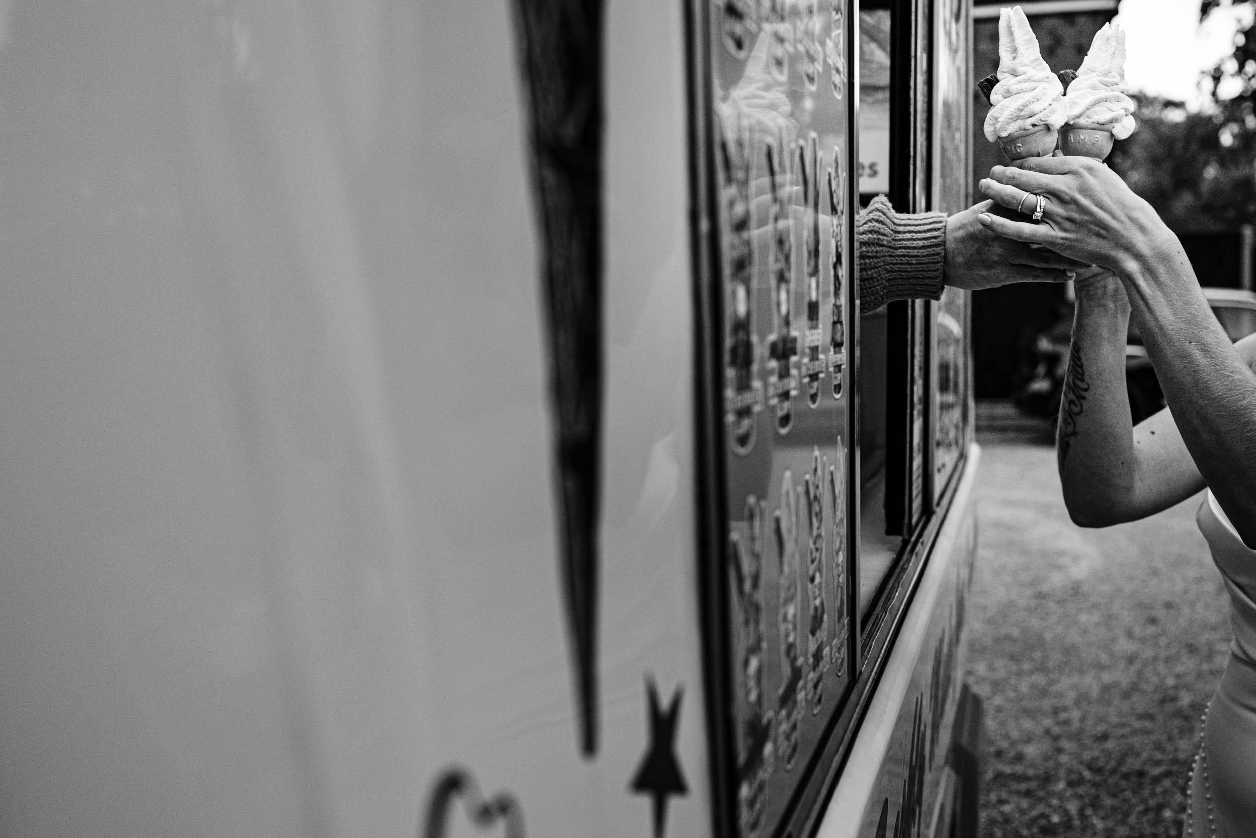bride and groom grabbing ice creams