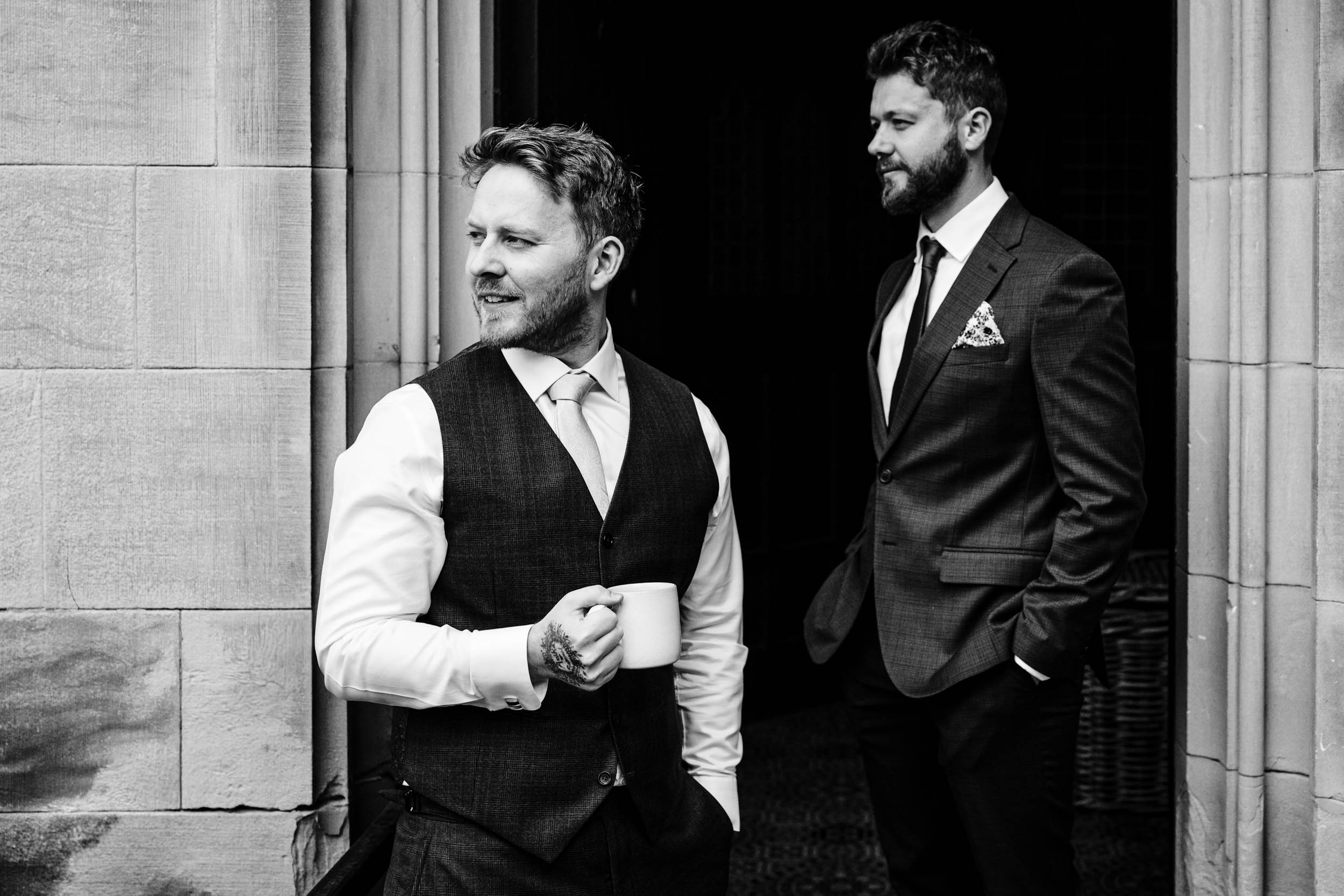 Groom Sam with his brother Ben the best man sharing a moment together