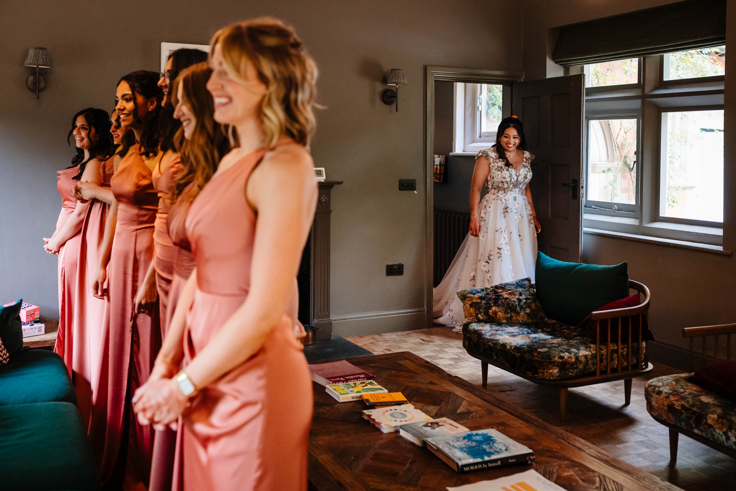 Bridal reveal moment with Anika on the right and bridesmaids lined up on the left