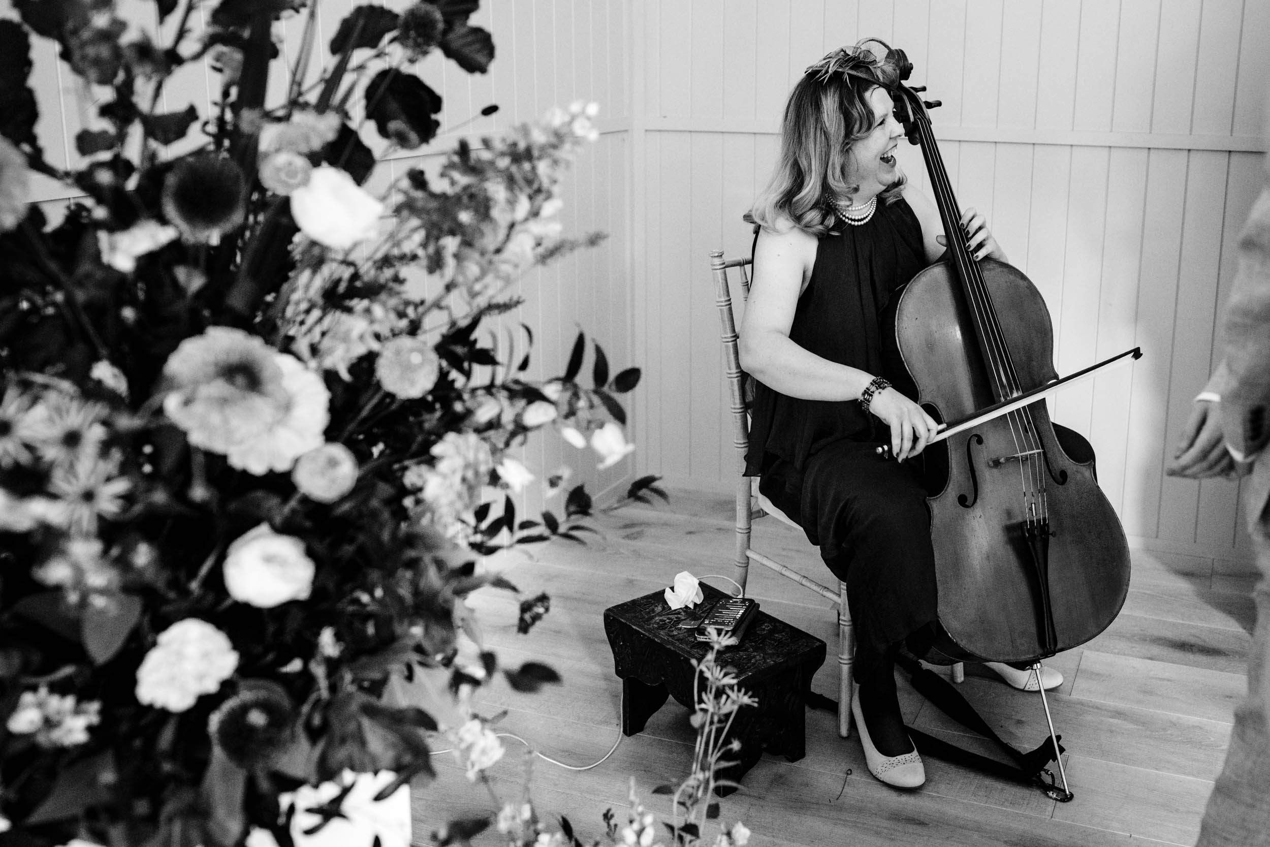 Cello player laughing before the ceremony begins