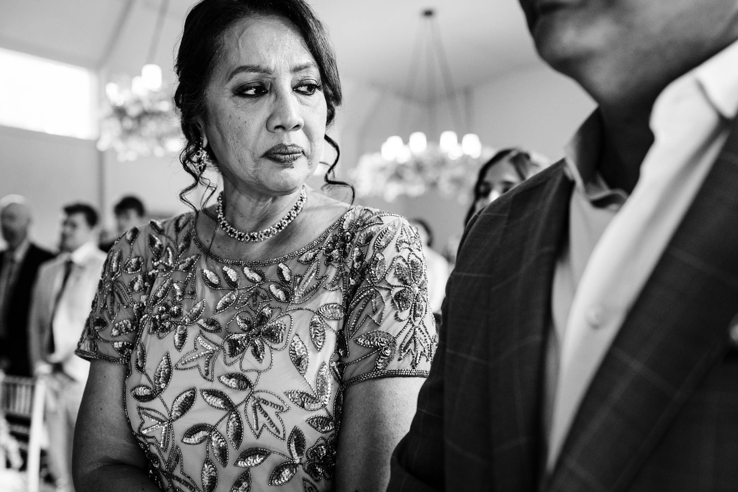 Anika’s mum looking down lovingly at her uncle during the ceremony