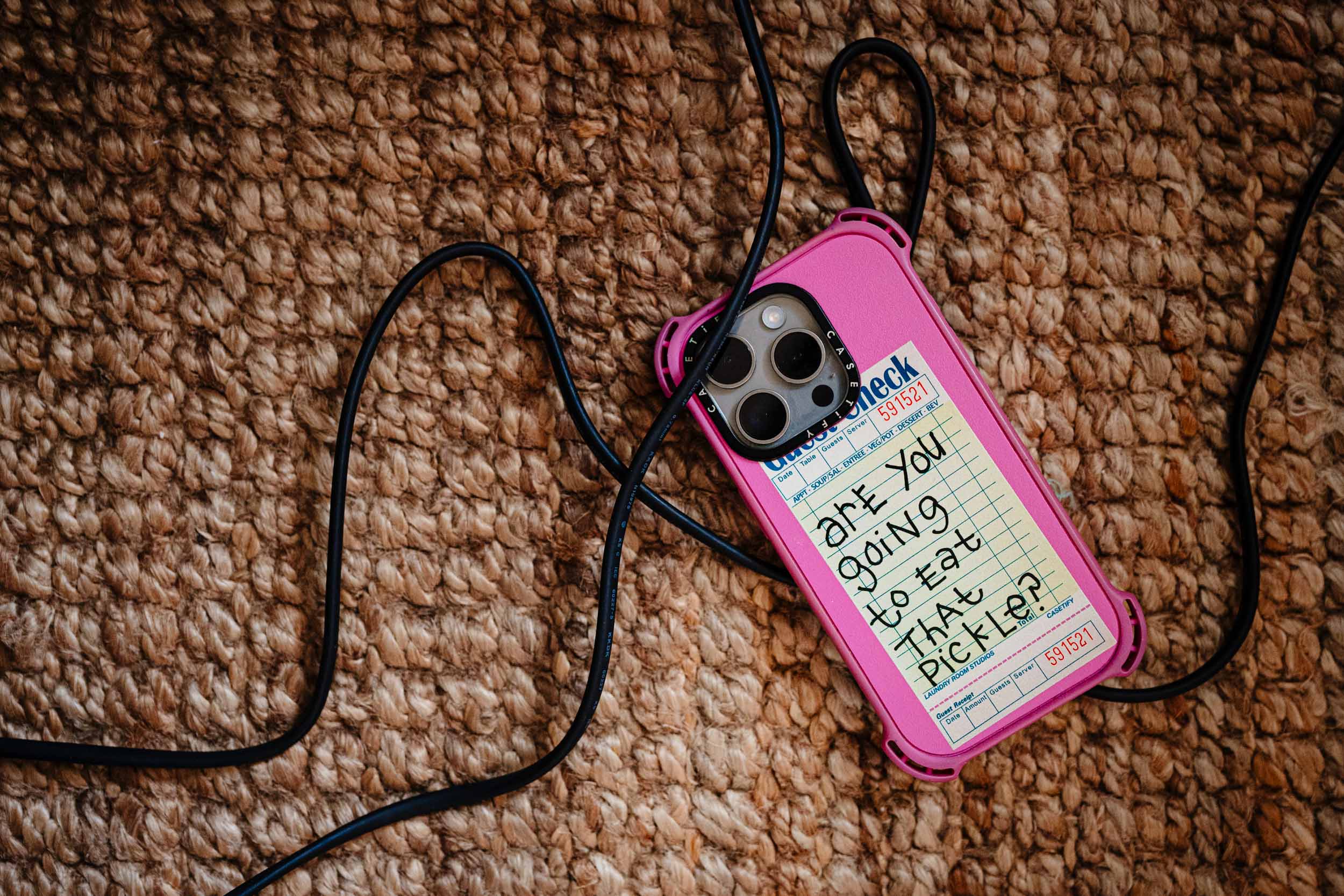 Back of a phone case with text saying are you going to eat that pickle