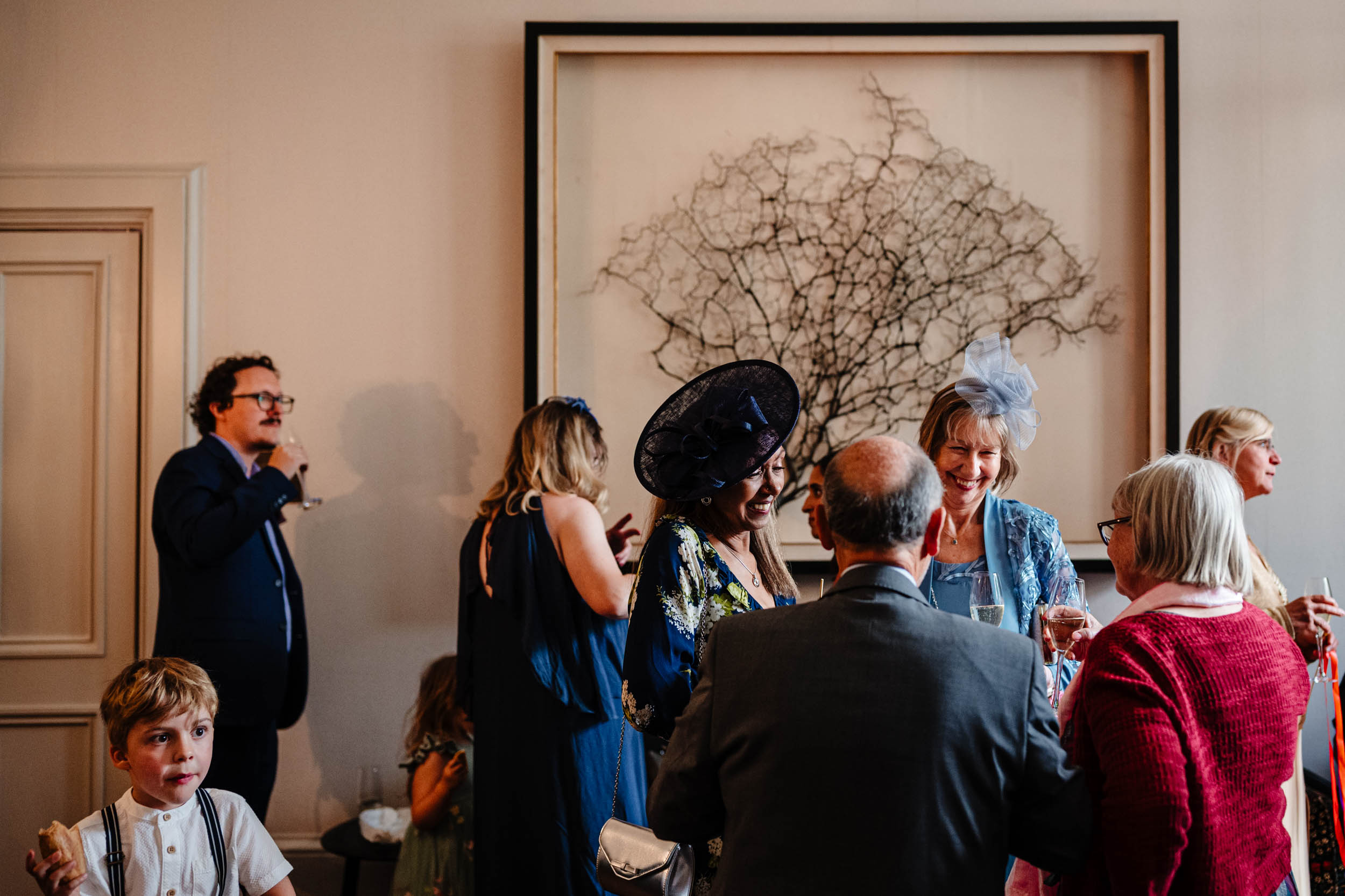 Guests chatting and laughing during the drinks reception