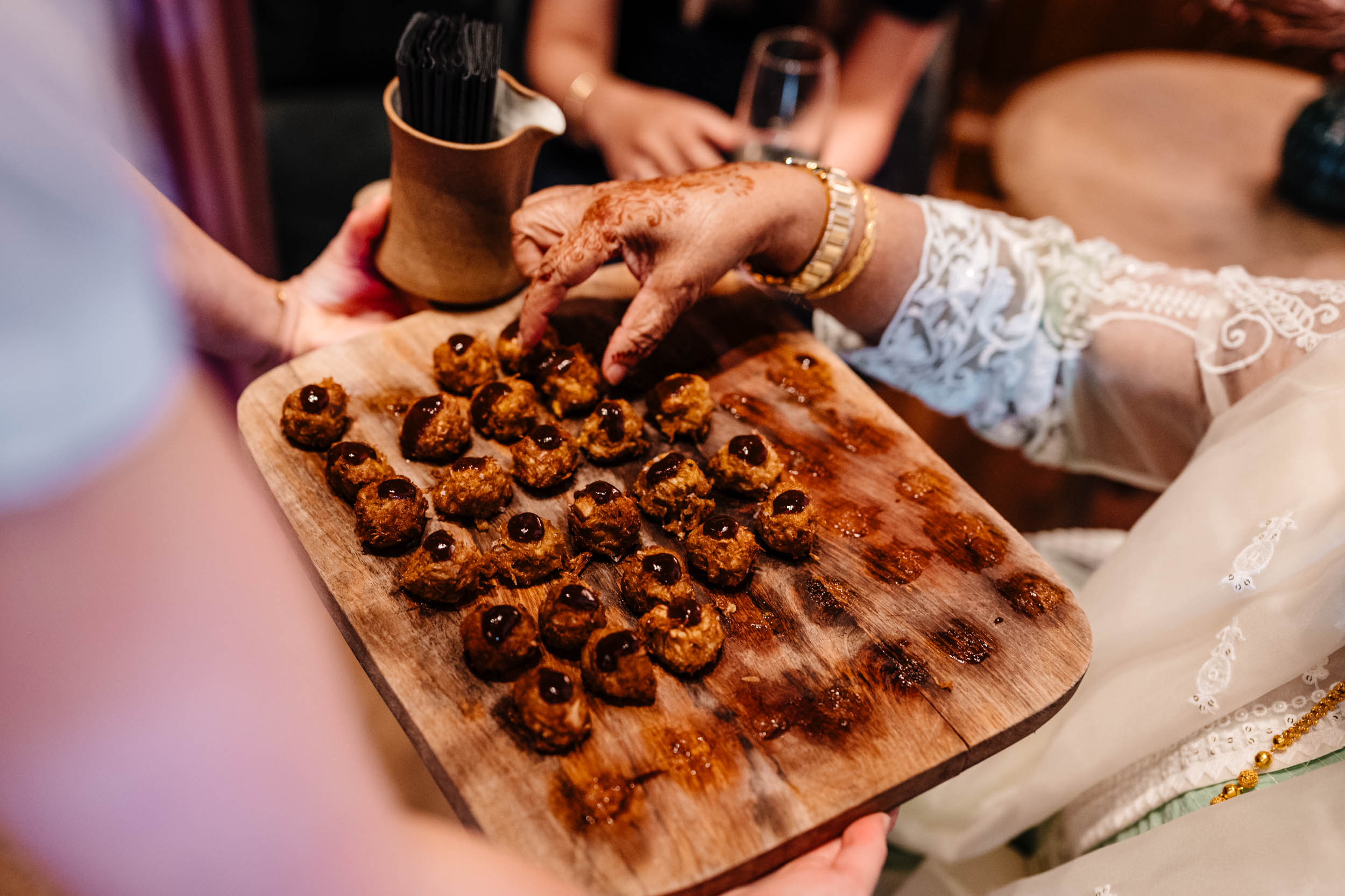Guest enjoying a canapé during the drinks reception