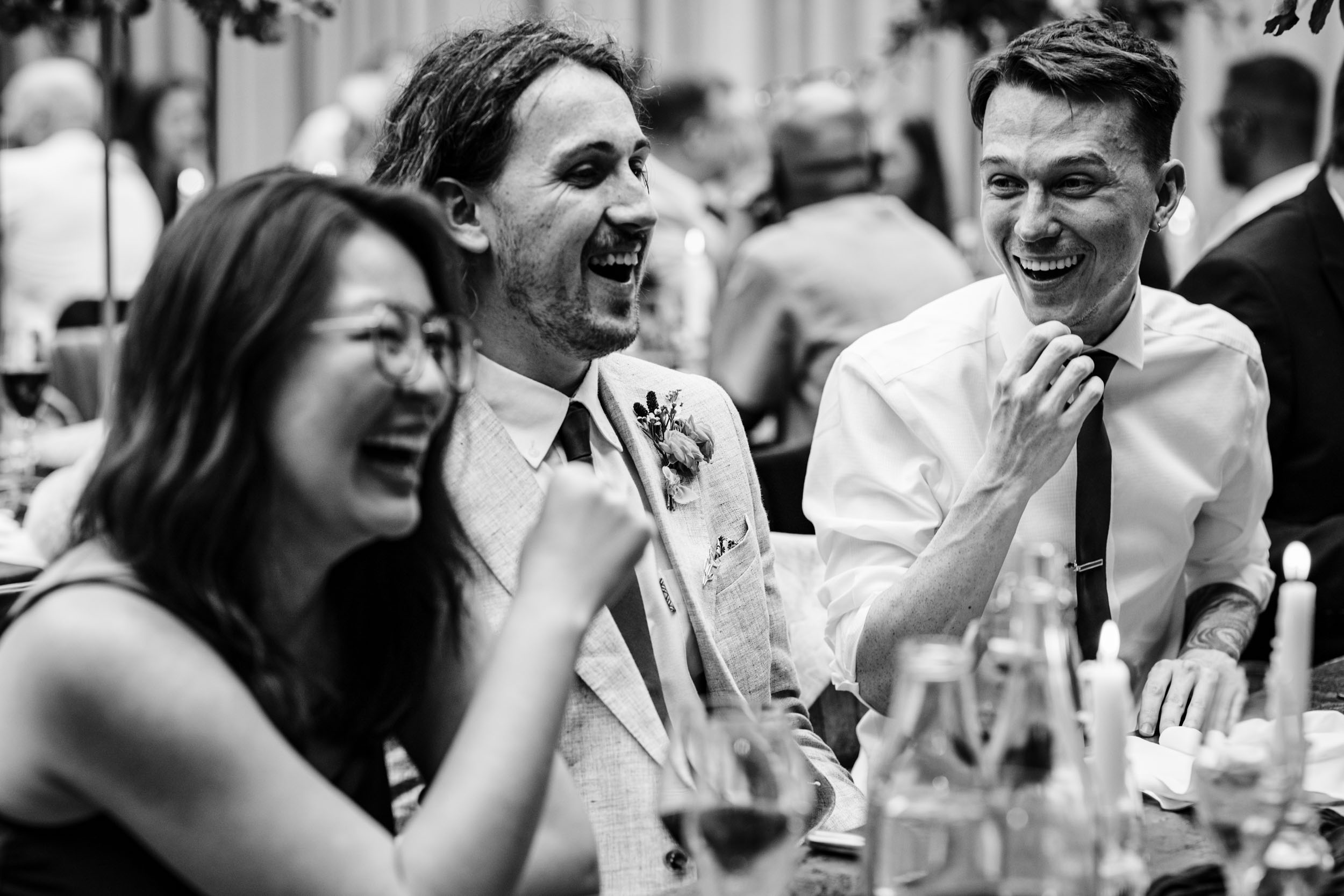 Guests laughing during the wedding speeches