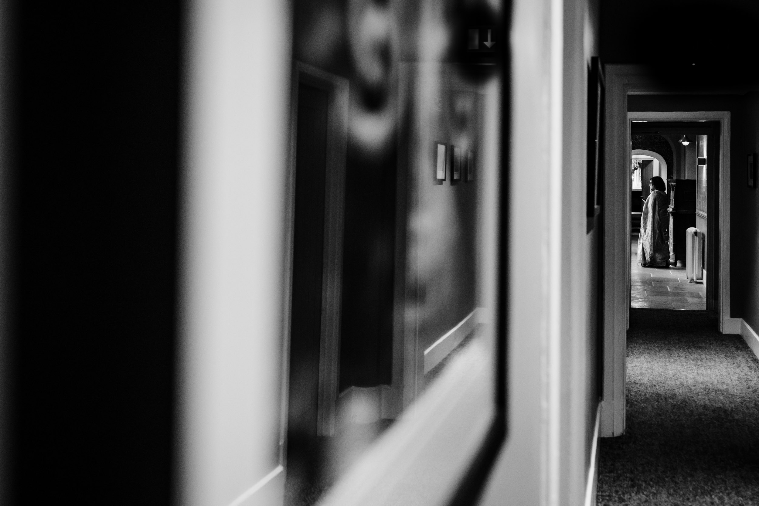Portrait of a lady standing in the corridor of Hampton Manor