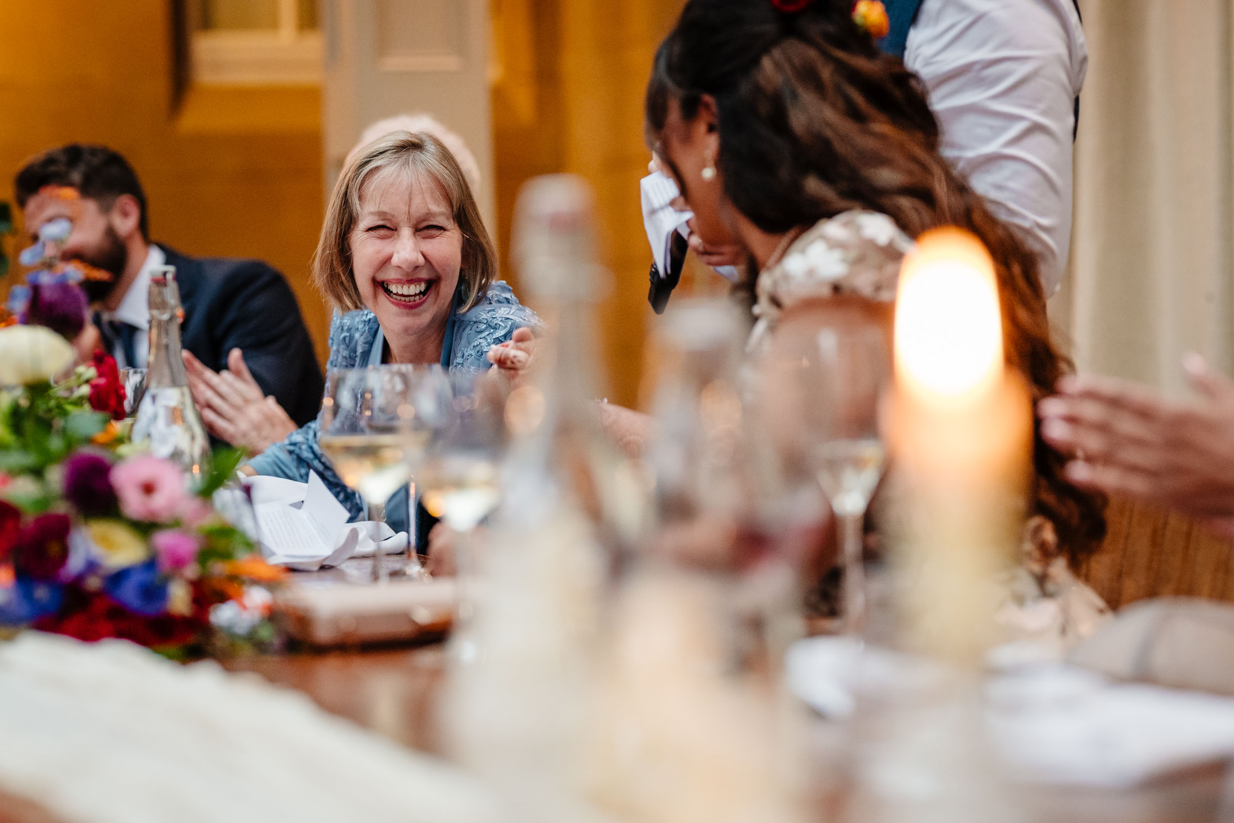 Groom’s mum laughing at the top table during speeches
