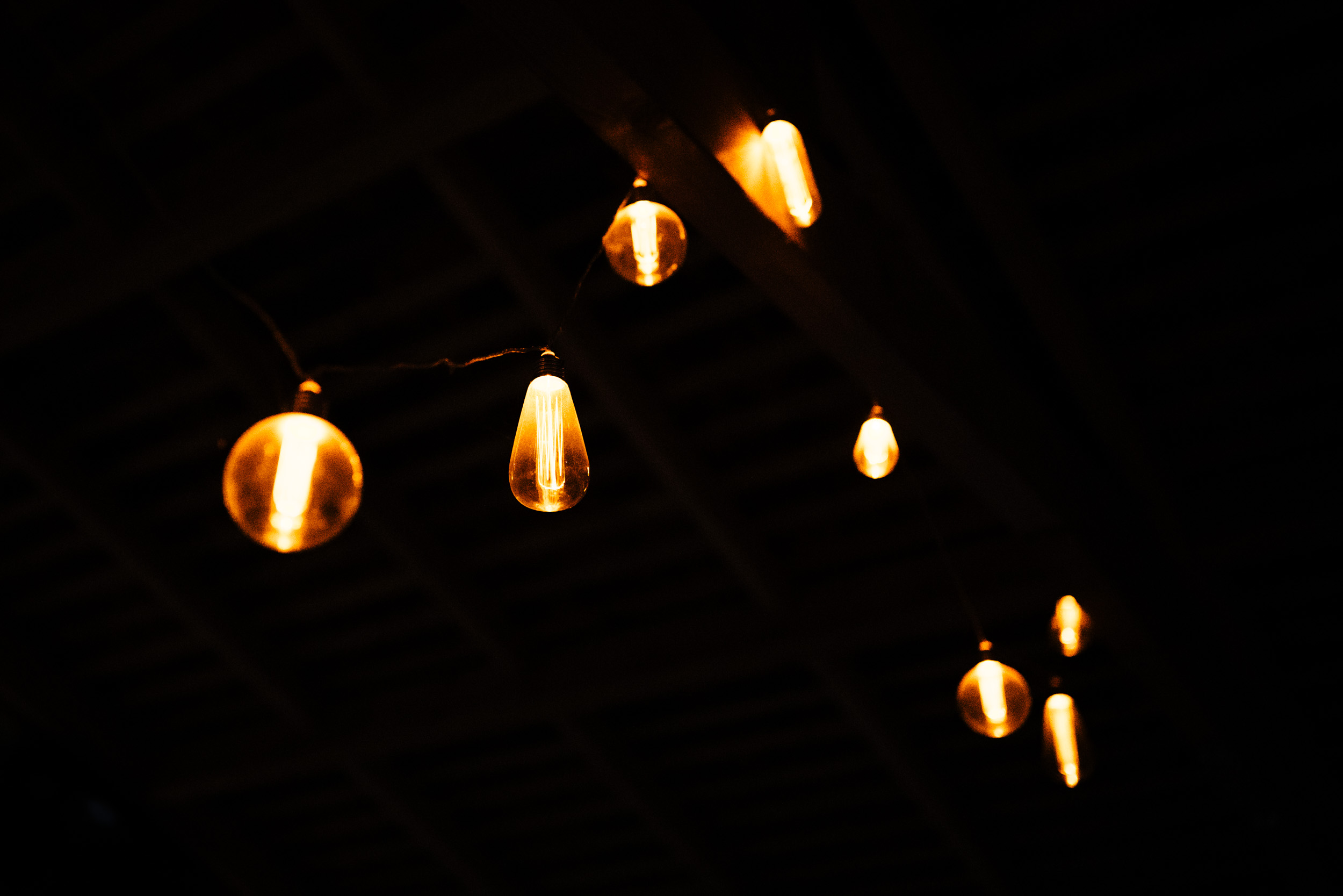 Festoon lights glowing outside the hotel at night