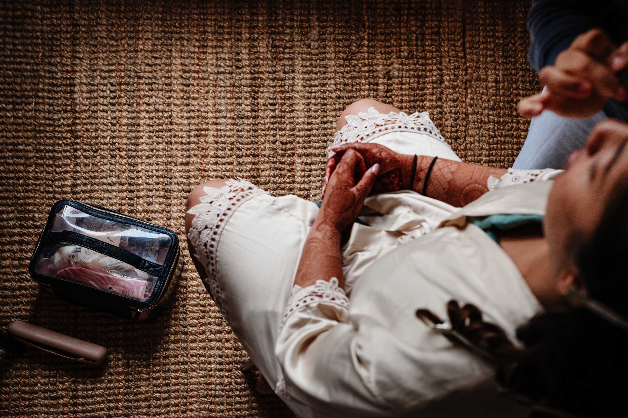 Overhead photo of Anika having her makeup done by her artist