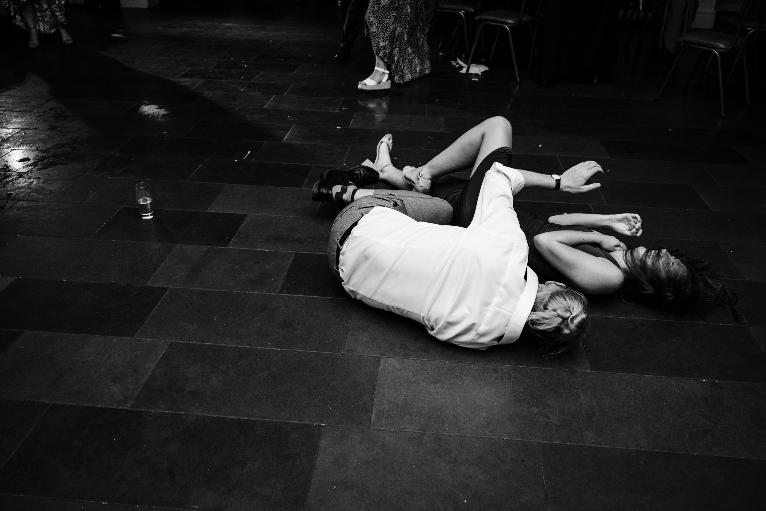 Guests lying on the dancefloor after falling mid dance