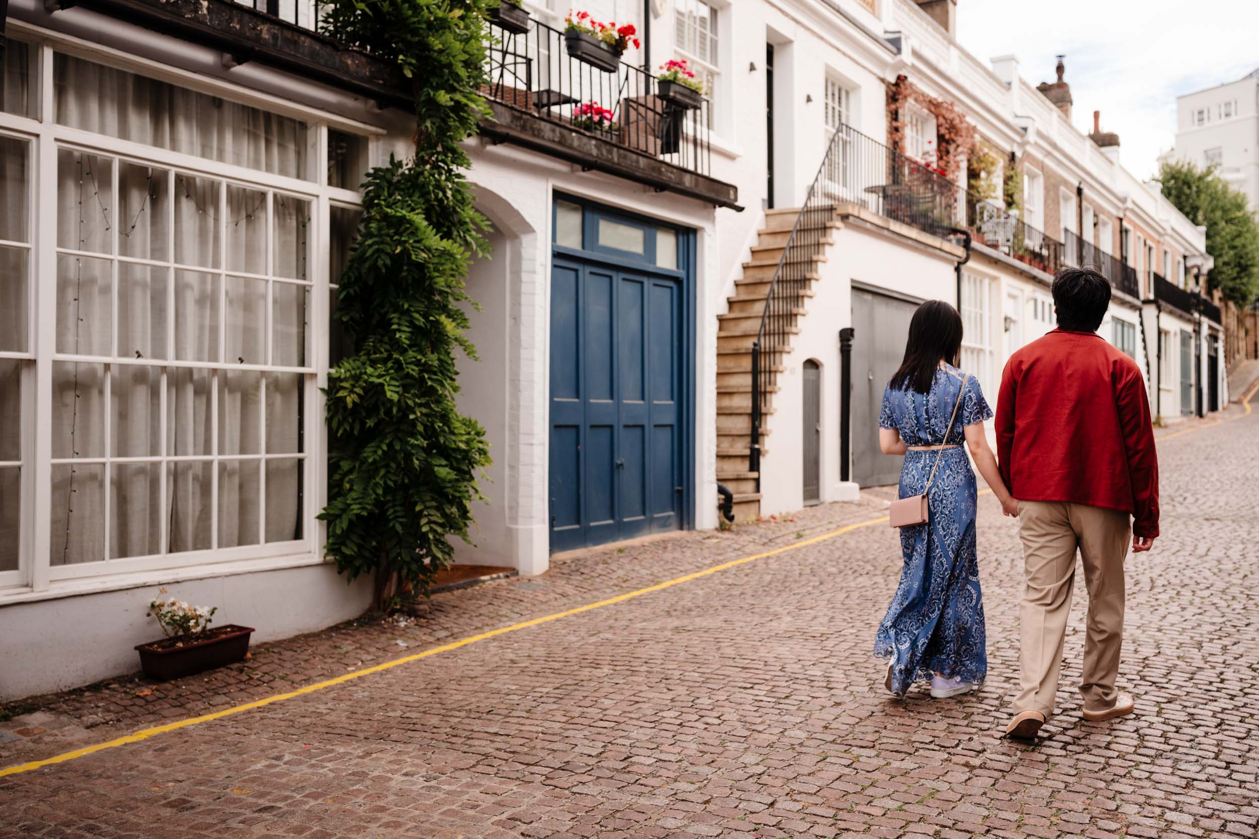 Final image of the couple walking away hand in hand down a London street after the proposal