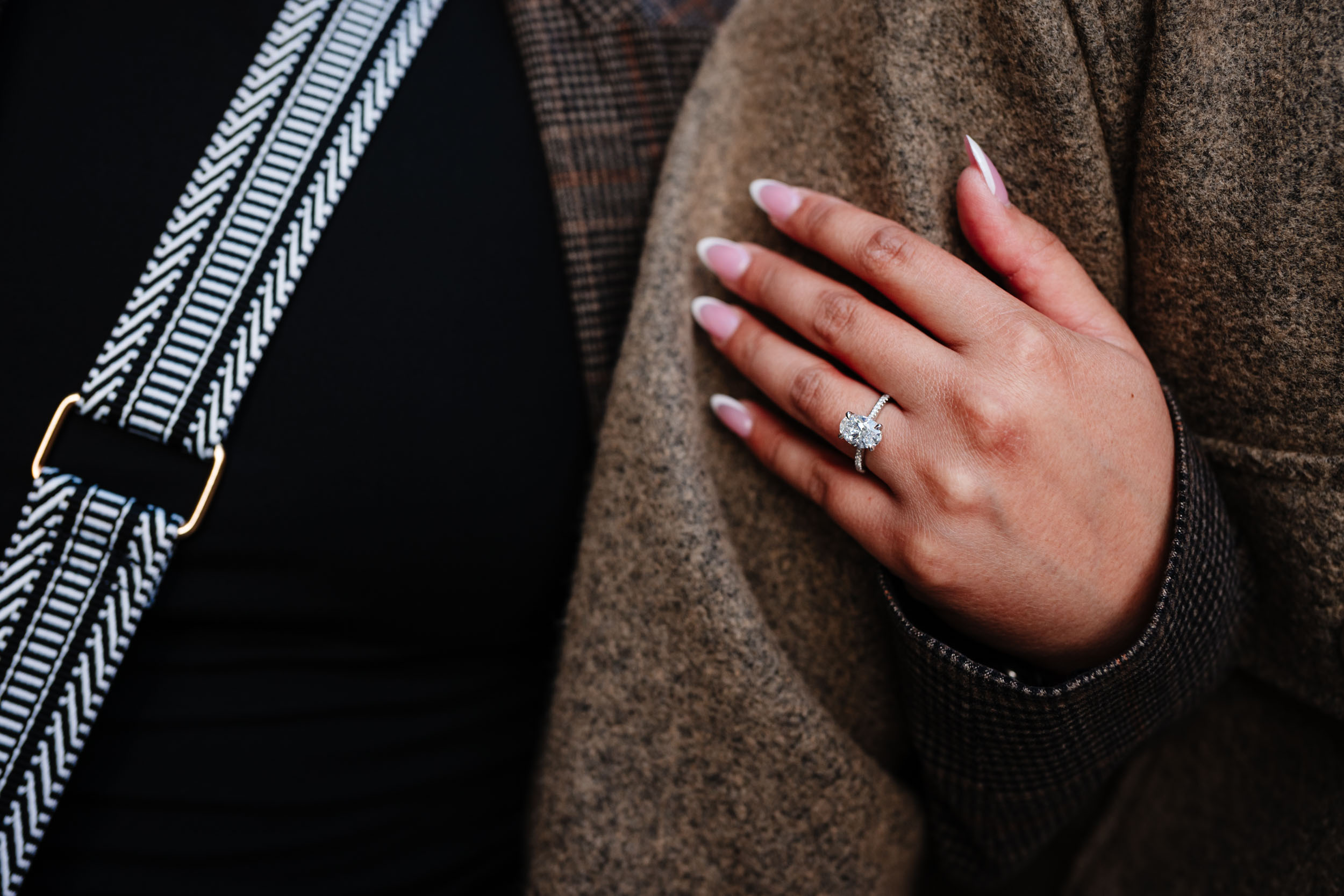 Close-up of engagement ring during Tower Bridge proposal