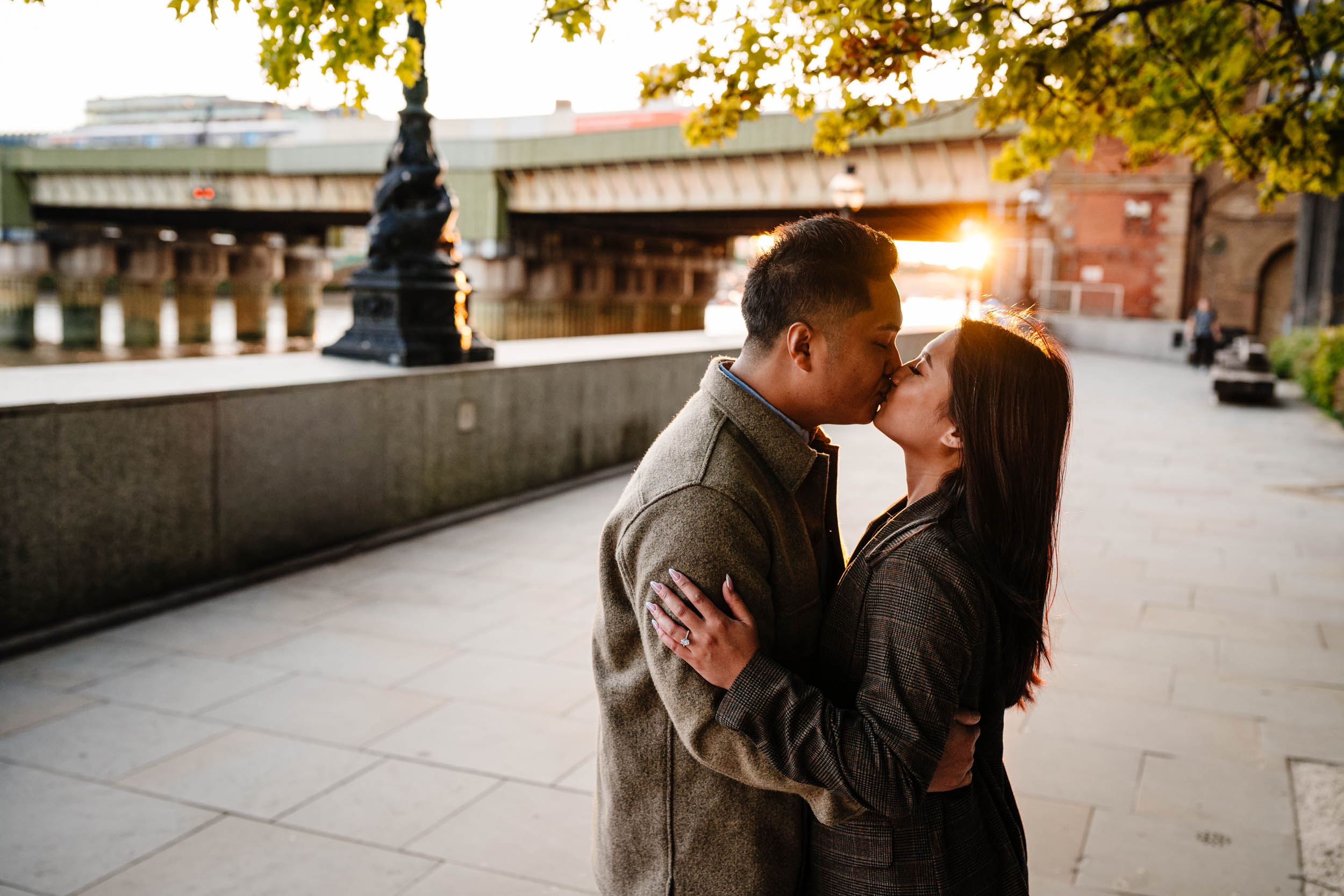 Romantic sunset portrait by the Thames with London skyline