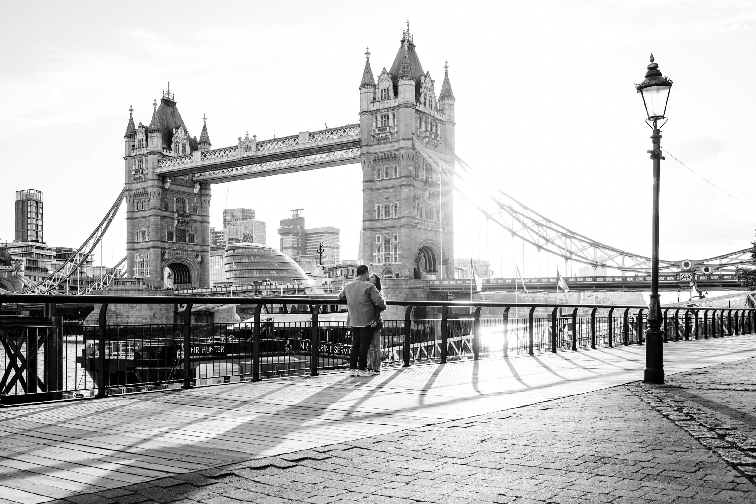 James just before proposing to Christine at Tower Bridge during sunset in London