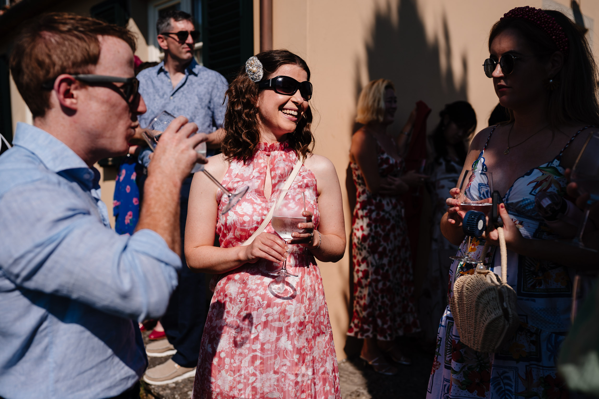 Wedding guests enjoying drinks and sunshine at Casale de Pasquinelli.
