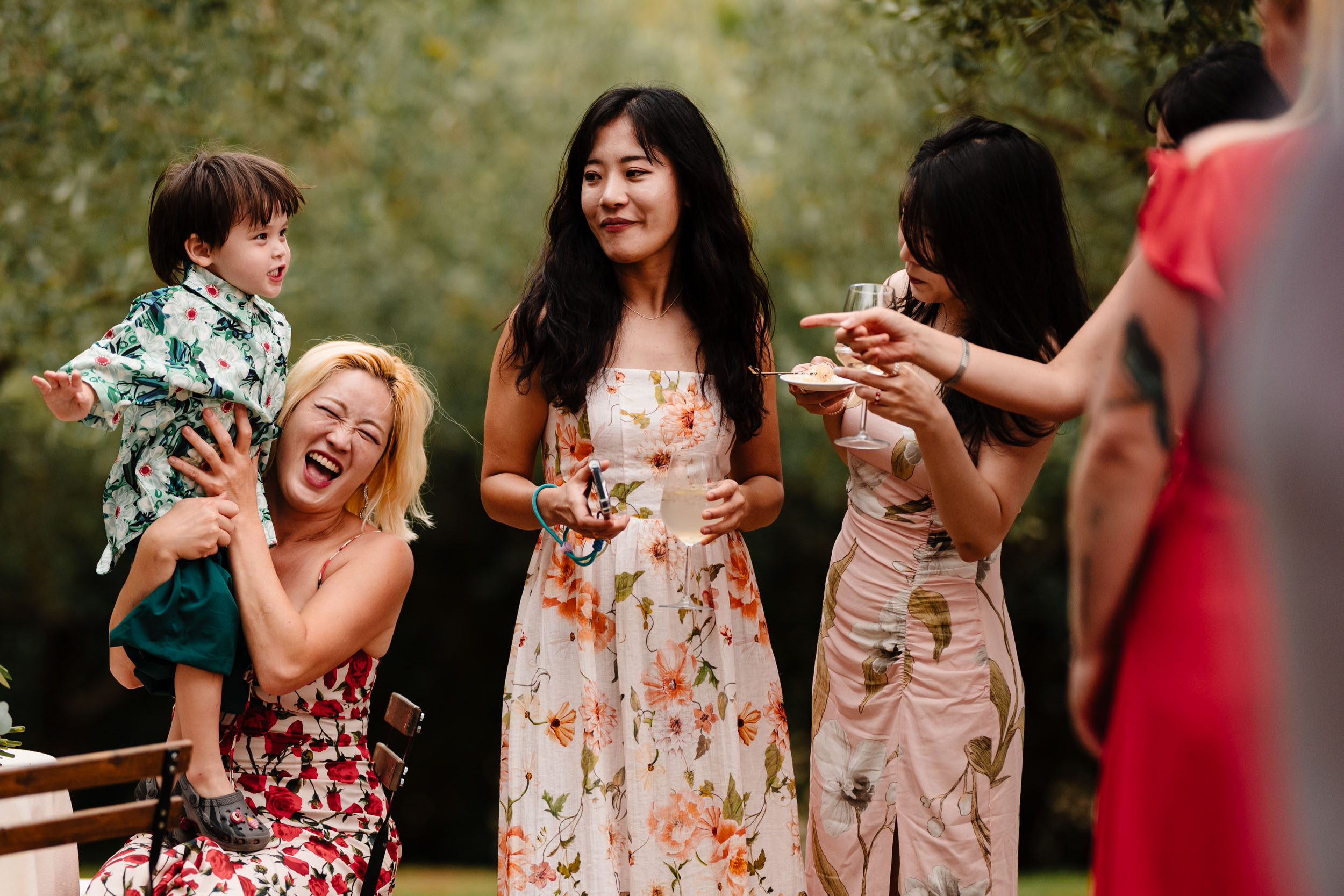 Group of guests chatting and laughing during the drinks reception.