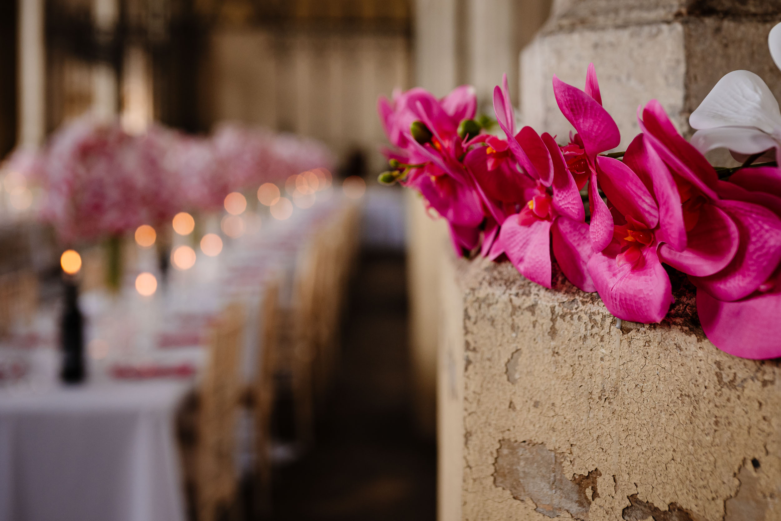 Reception tables and flowers set up inside HAC Bow before guests arrive.