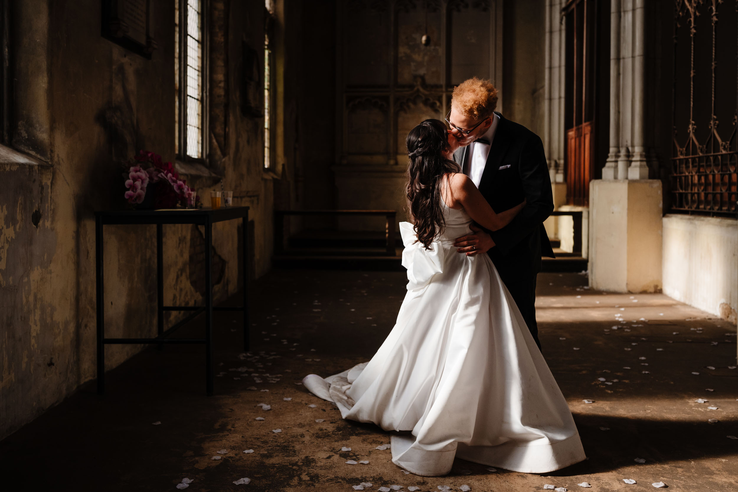 Bride and groom sharing a kiss during the reception at HAC Bow.