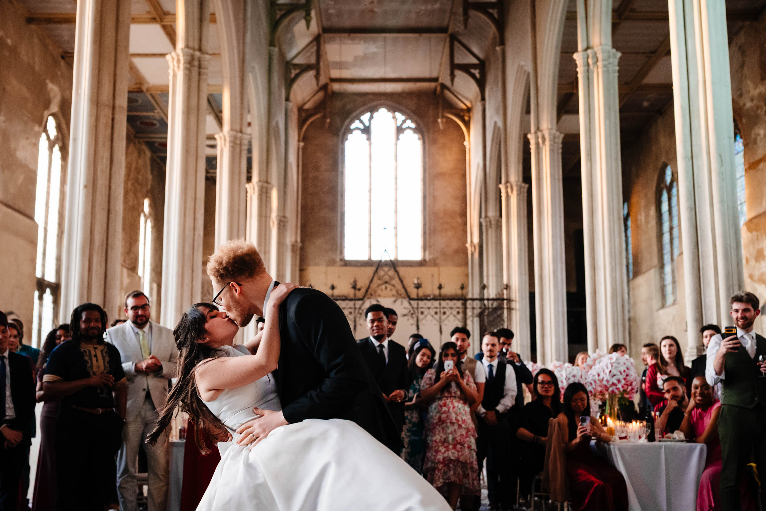 Sylvia and Joe kissing during their first dance, intimate moment on the dance floor.