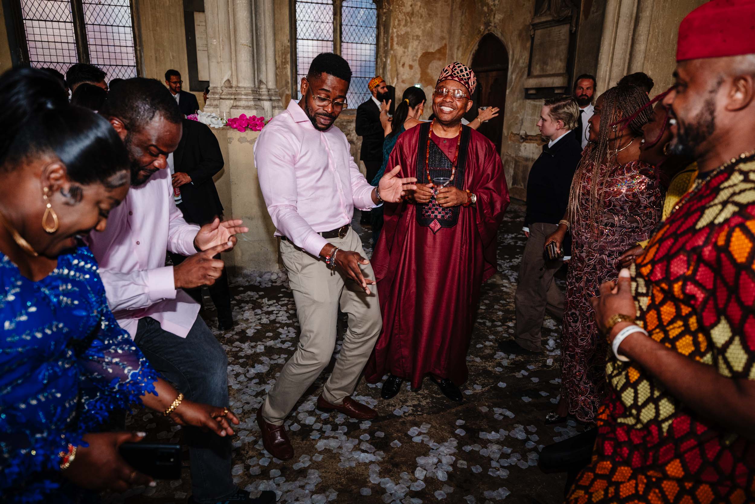 Guests dancing at the wedding reception, lively dance floor energy.