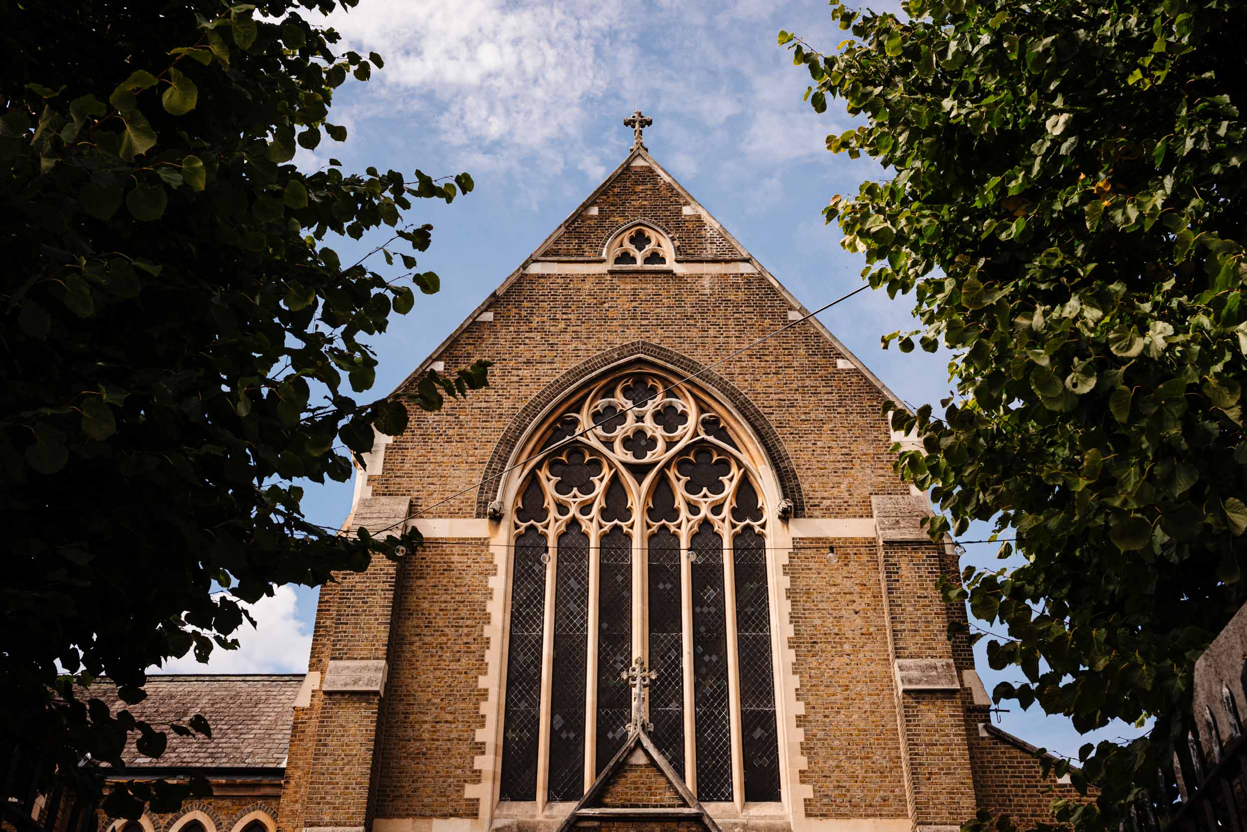 Exterior of St Anthony of Padua church in Forest Gate, looking upward to the sky.