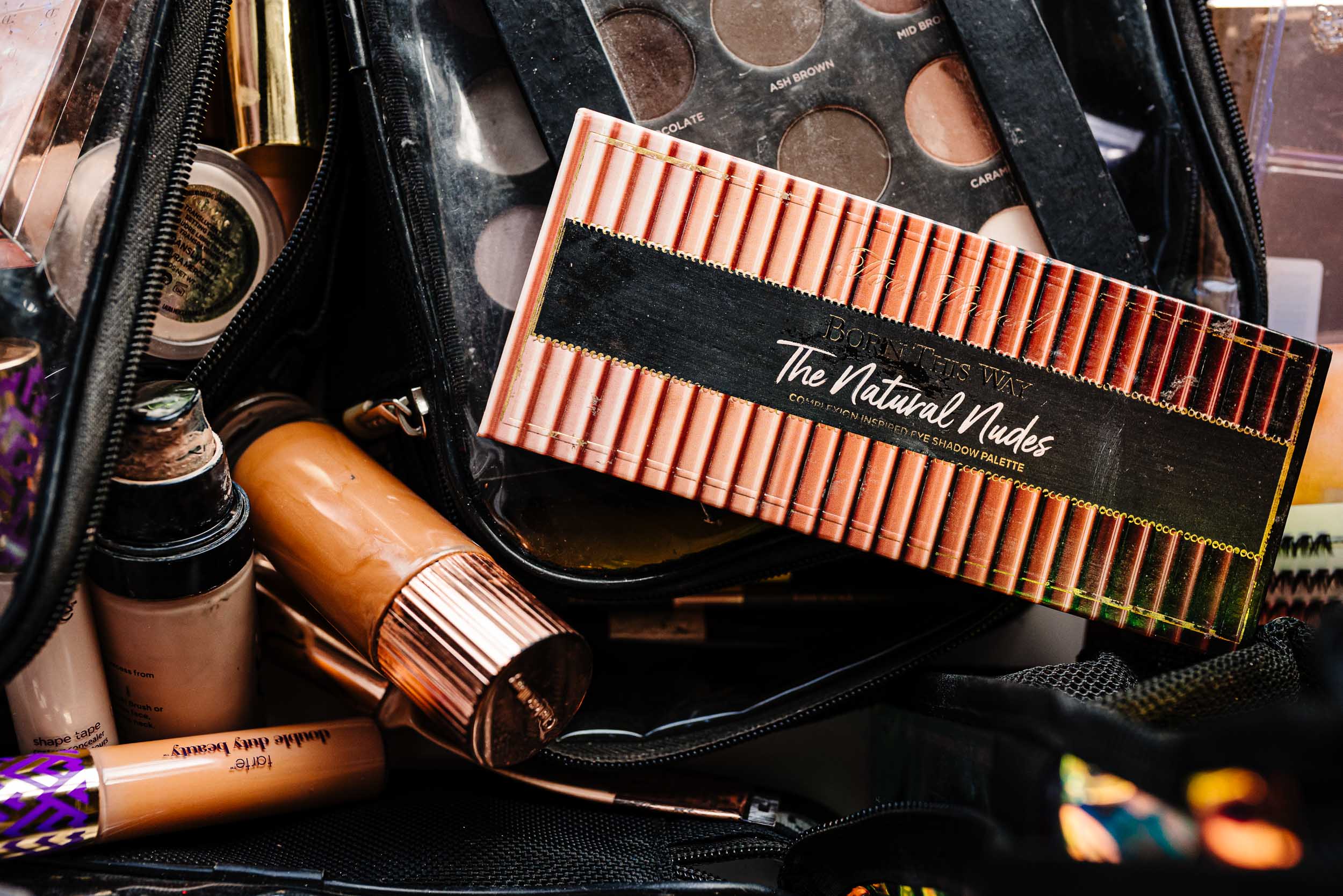 Close up of wedding day makeup products laid out