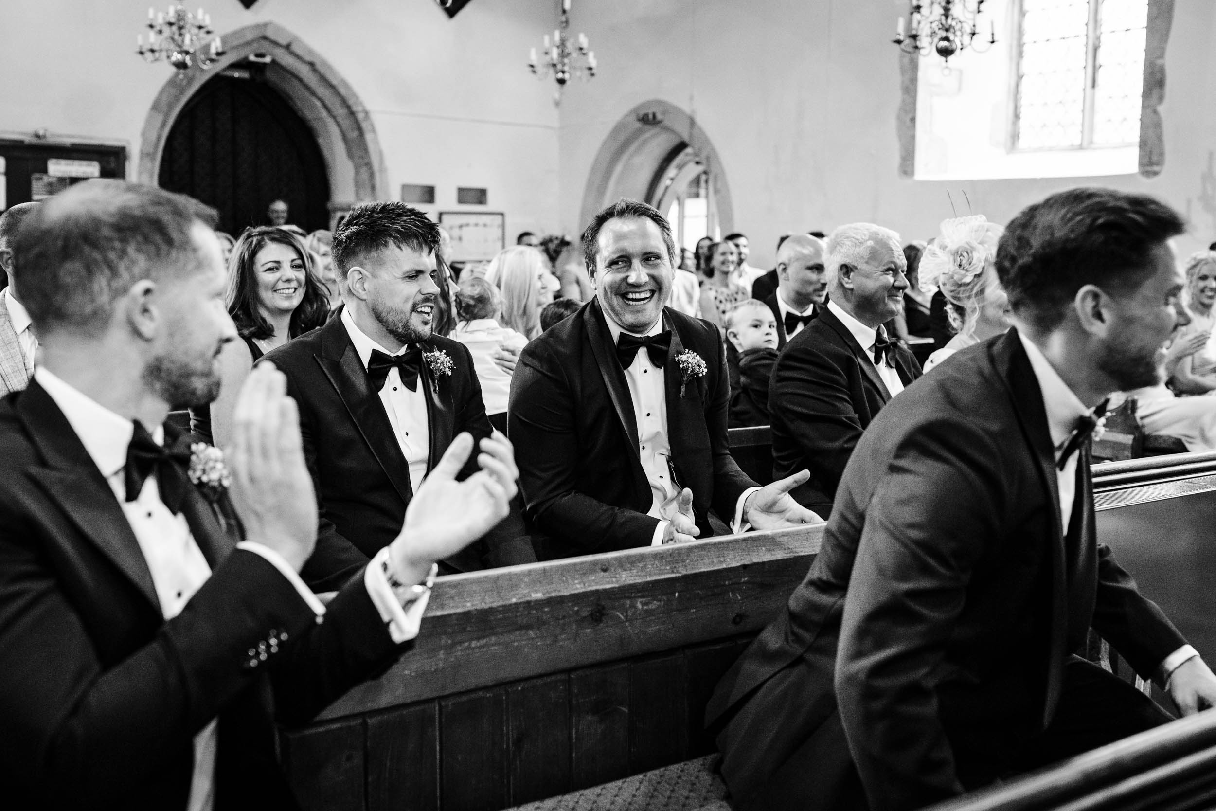 Guests laughing during the wedding ceremony