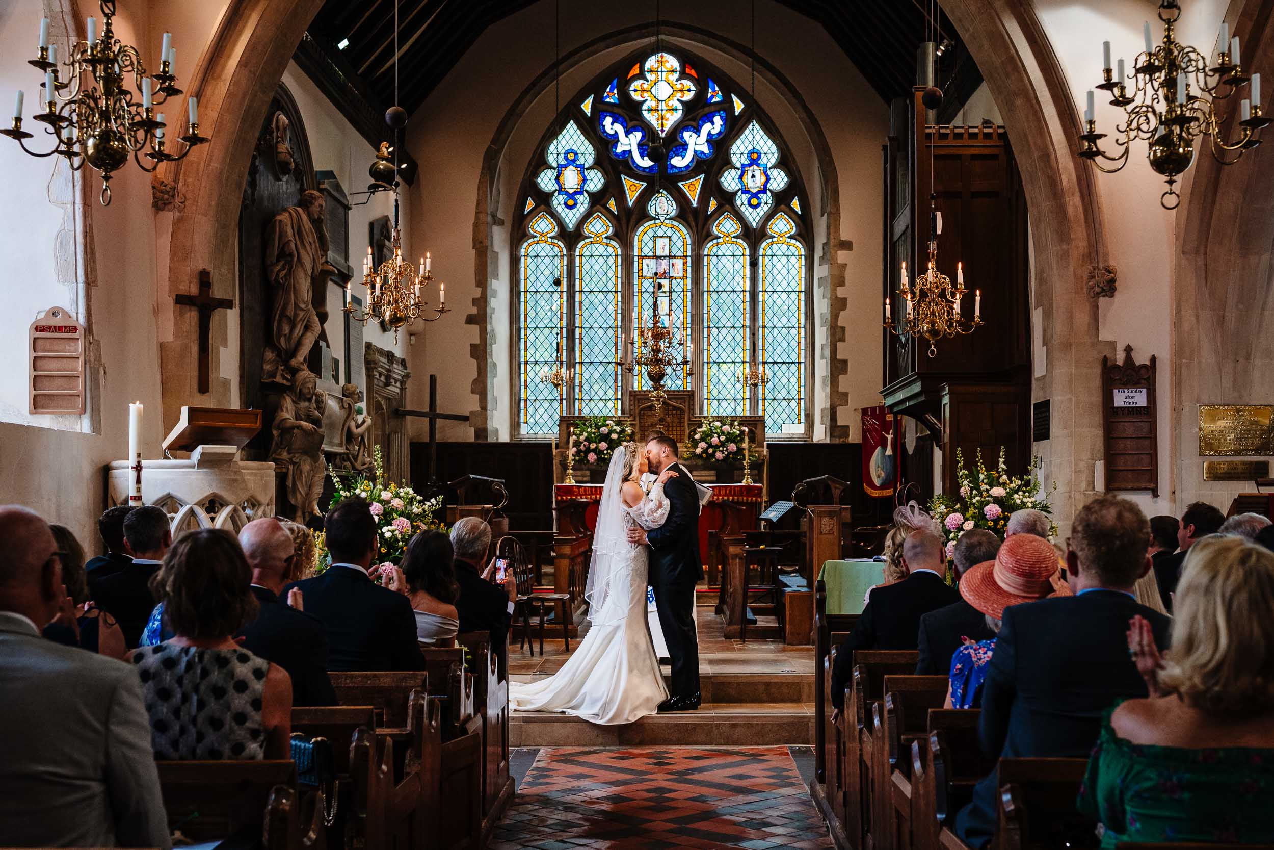 Bride and groom first kiss