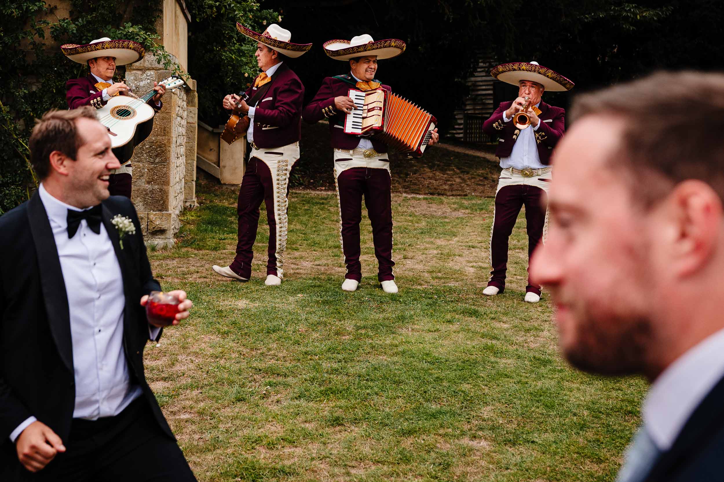 Mariachi band performing with guests in the foreground