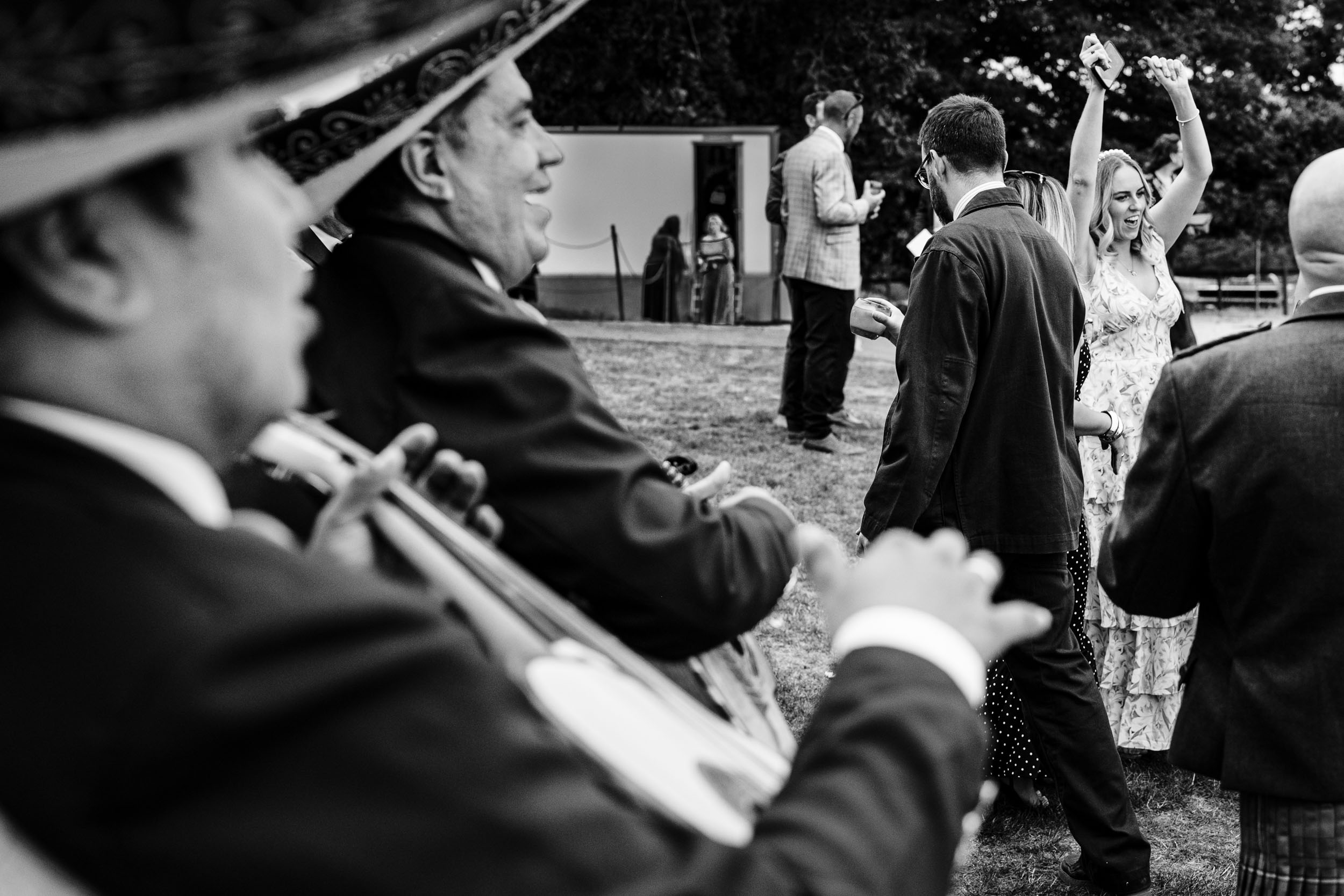 Guest dancing while the mariachi band plays beside them