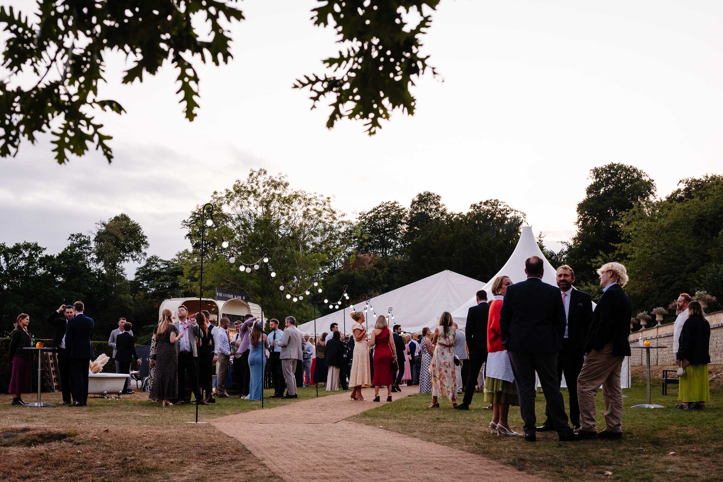 Guests chatting and mingling outside