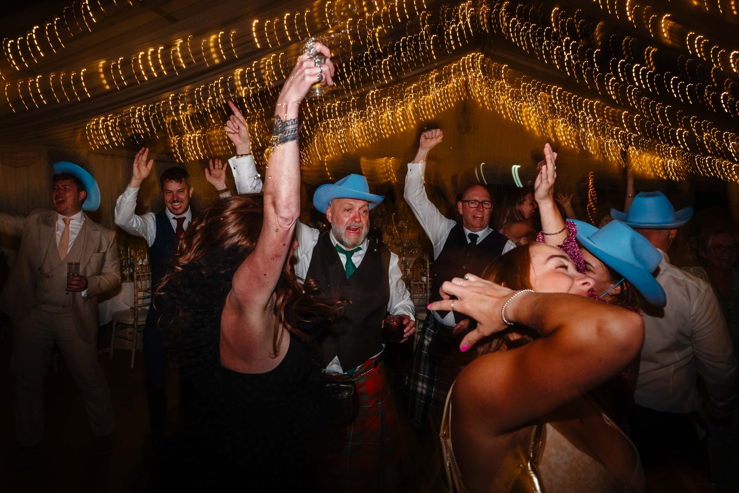 Wedding guests having an amazing time on the dance floor