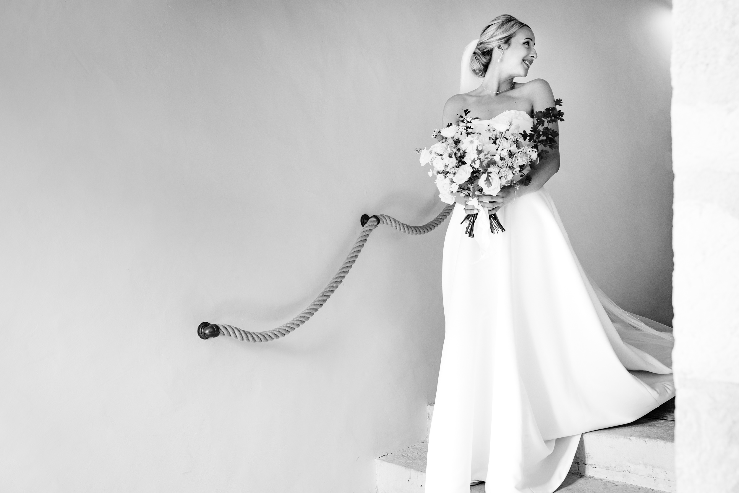 Bride walking down the stairs towards the ceremony