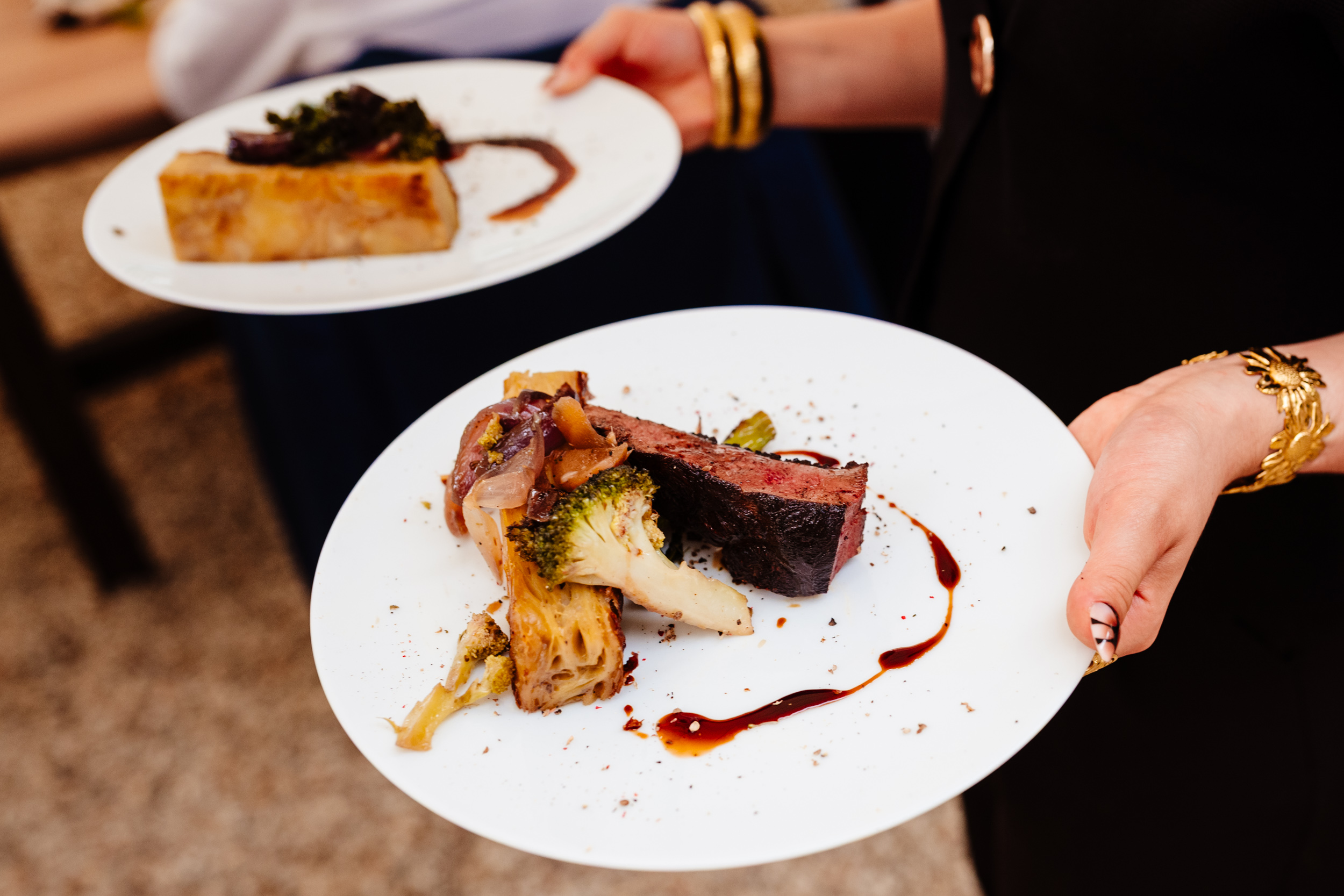 Waiter carrying plated food during the wedding meal