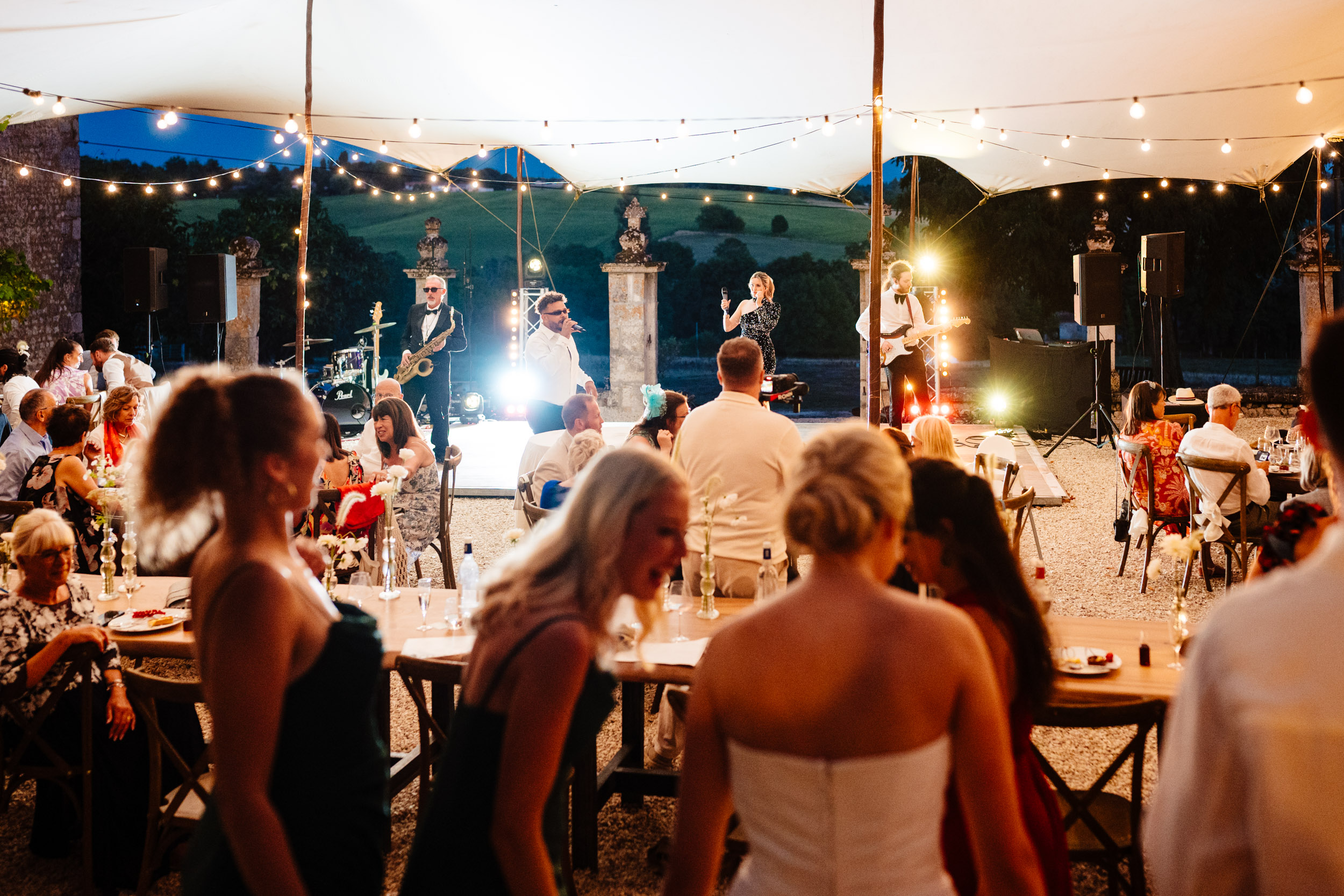 Wedding band starting to play as guests gather on the dance floor