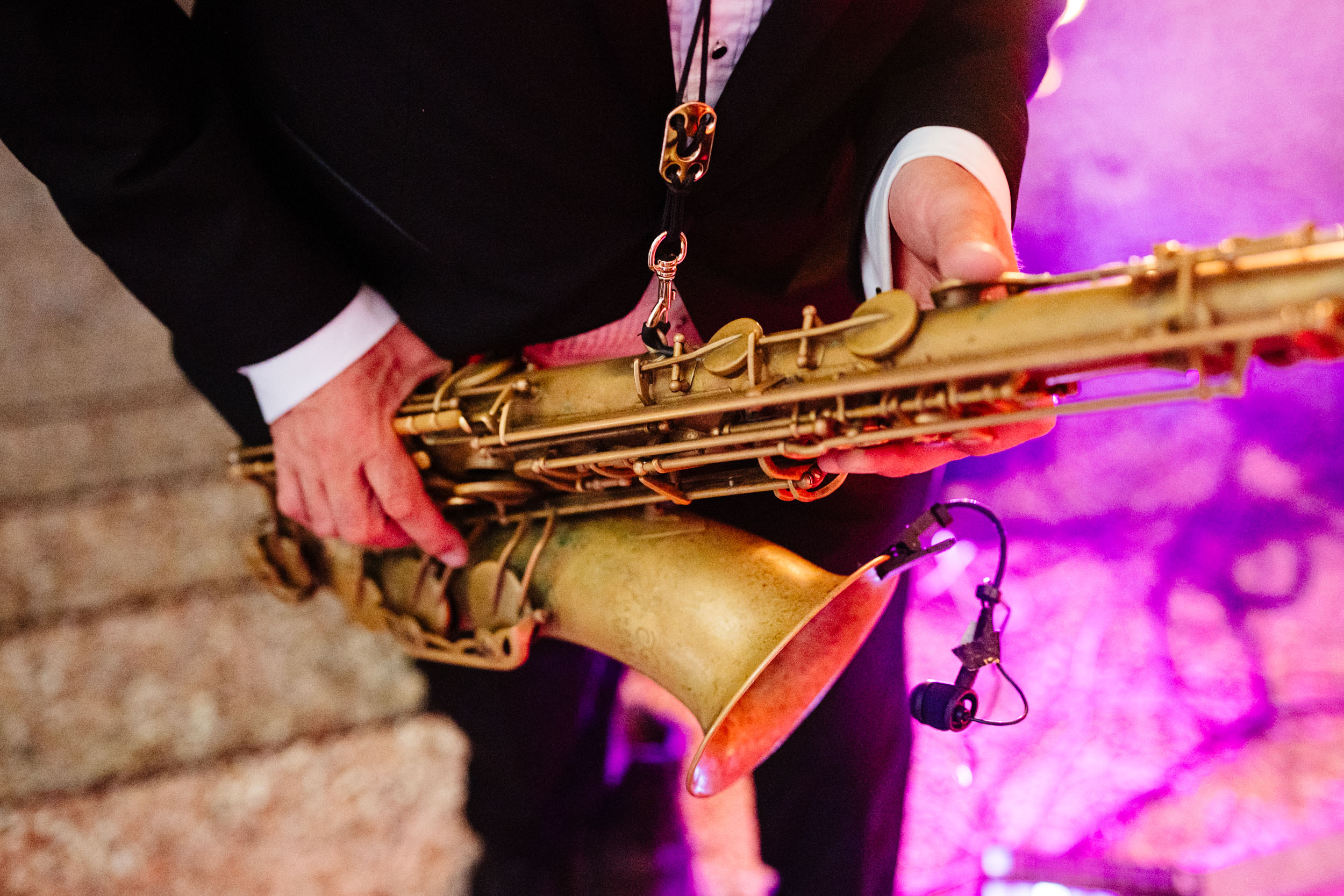 Close-up of the saxophone player performing during the evening celebrations