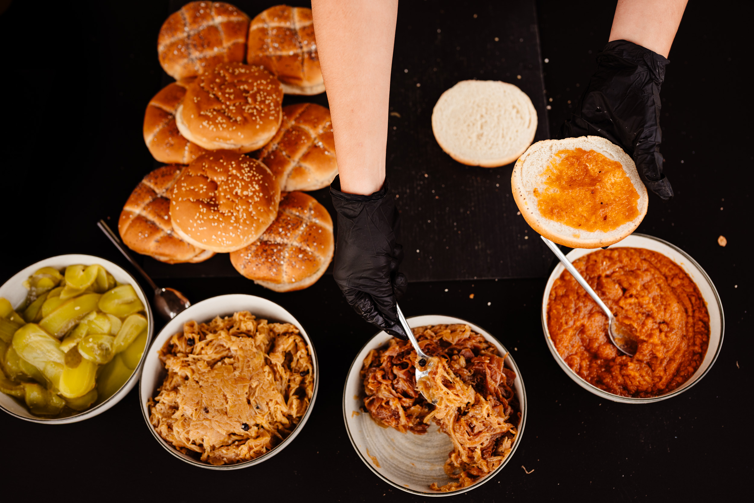 Close-up of burgers being cooked during the wedding pool party