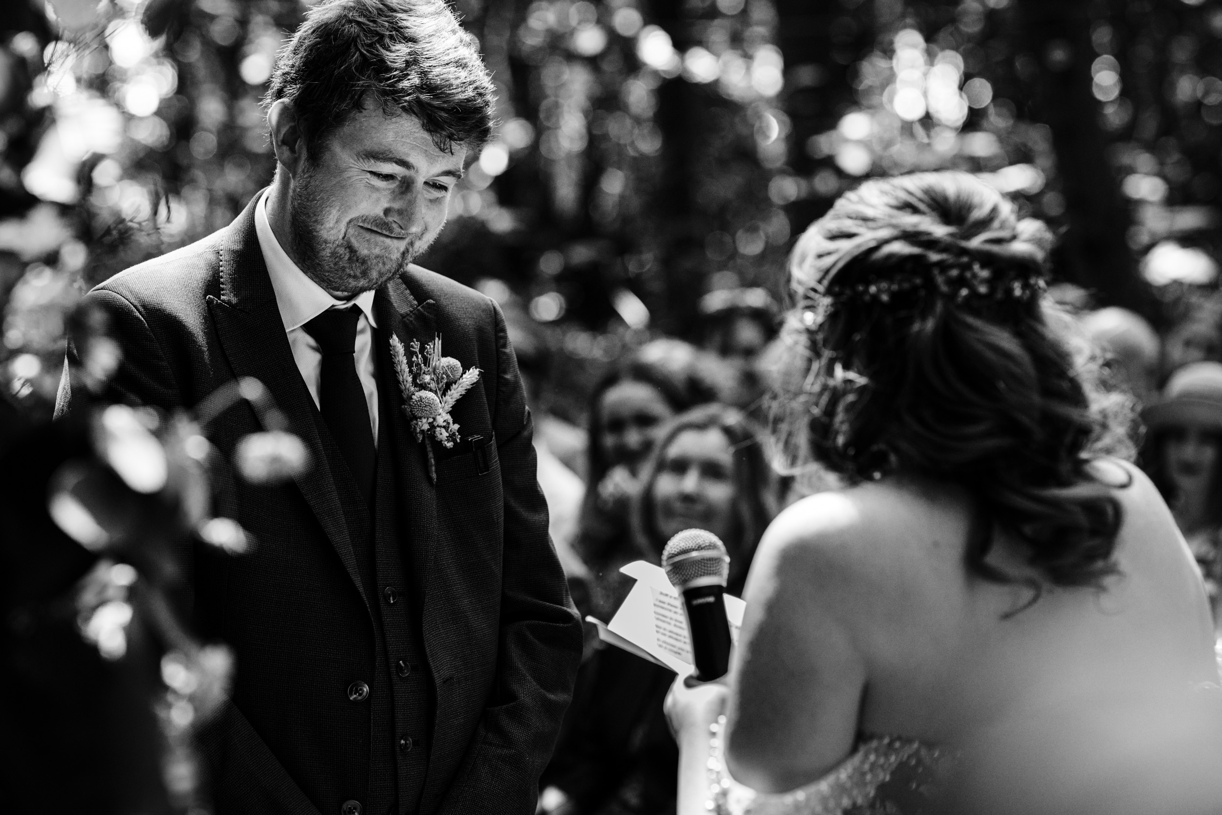 Groom reacting emotionally to the bride’s vows during the ceremony