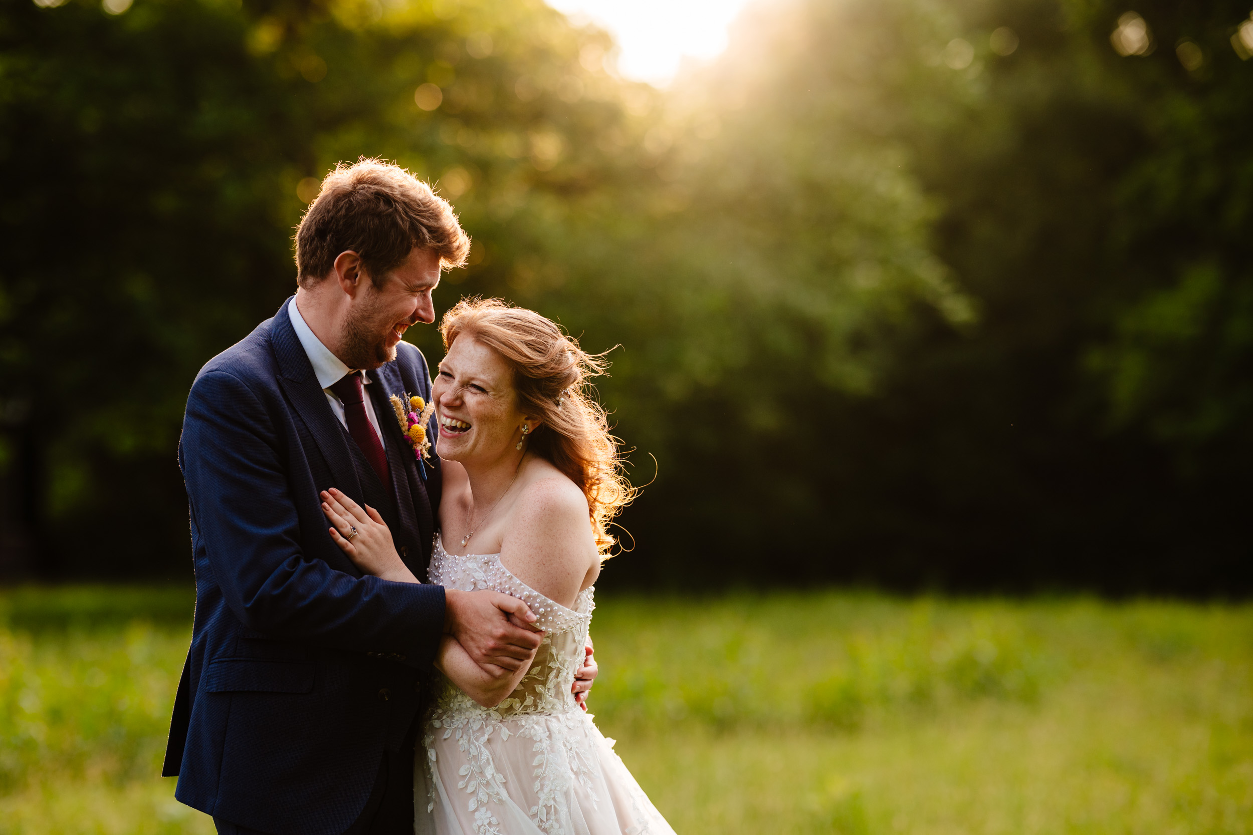 Bride and groom laughing together during relaxed couple time